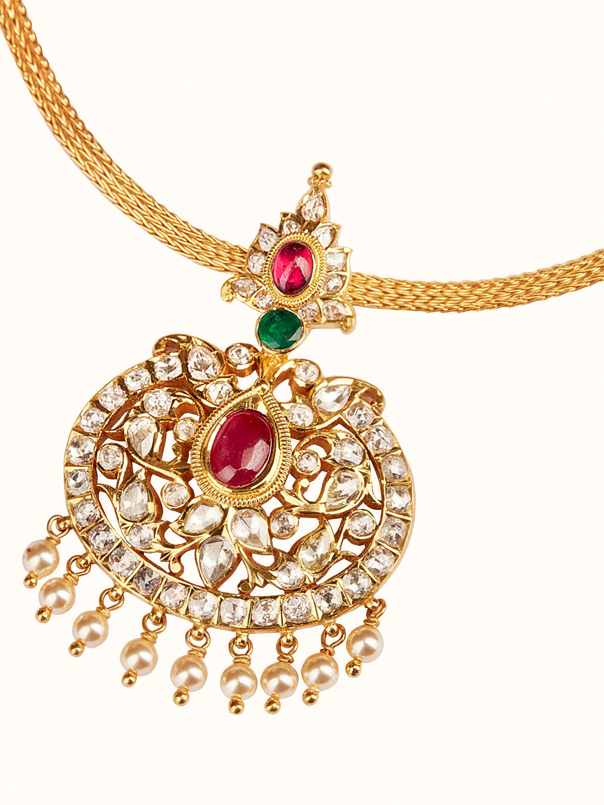 Close-up overhead view highlighting intricate gold work on collar necklace
