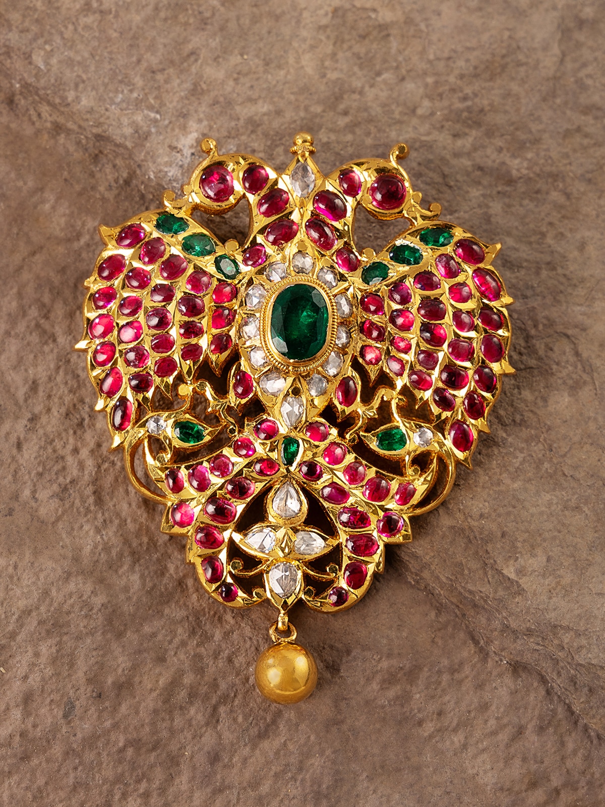 Side angle showing craftsmanship and design of the gold brooch pin