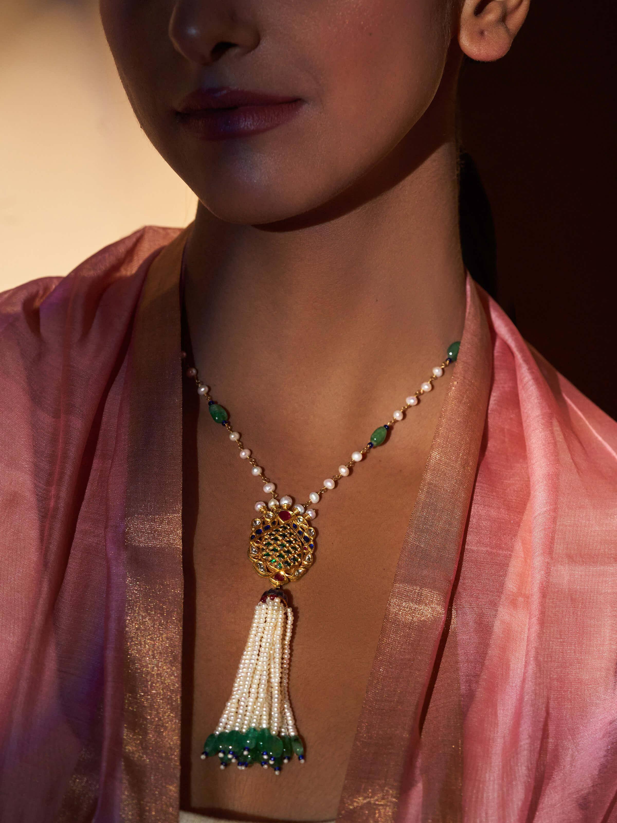 Side view focusing on the pendant’s intricate craftsmanship