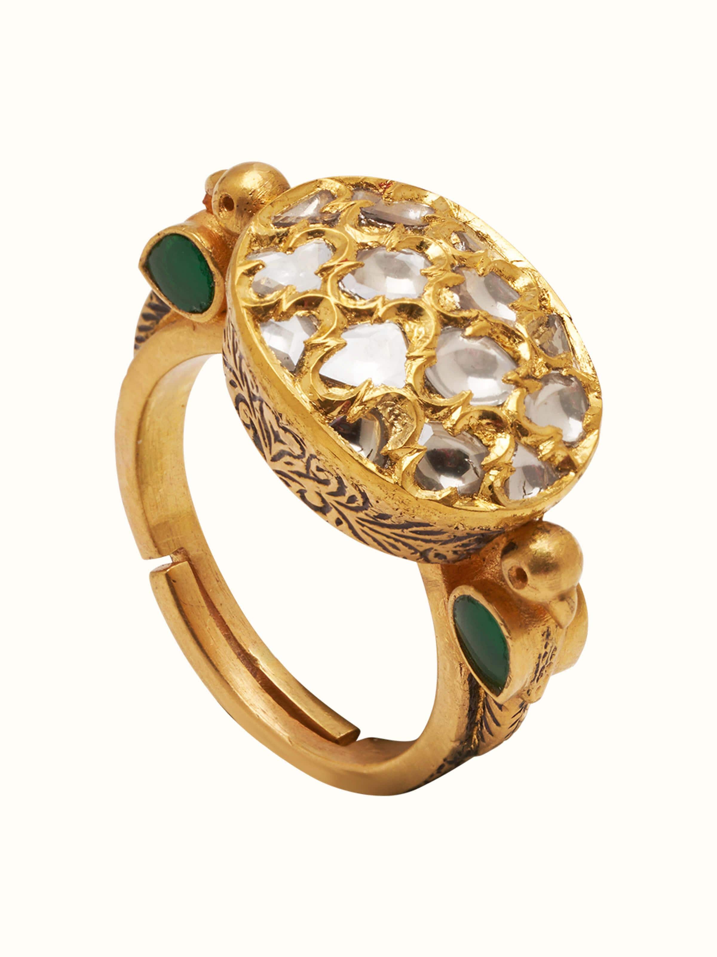 Front view of Badroom 22 Karat gold ring featuring embossed floral detailing and circular band.