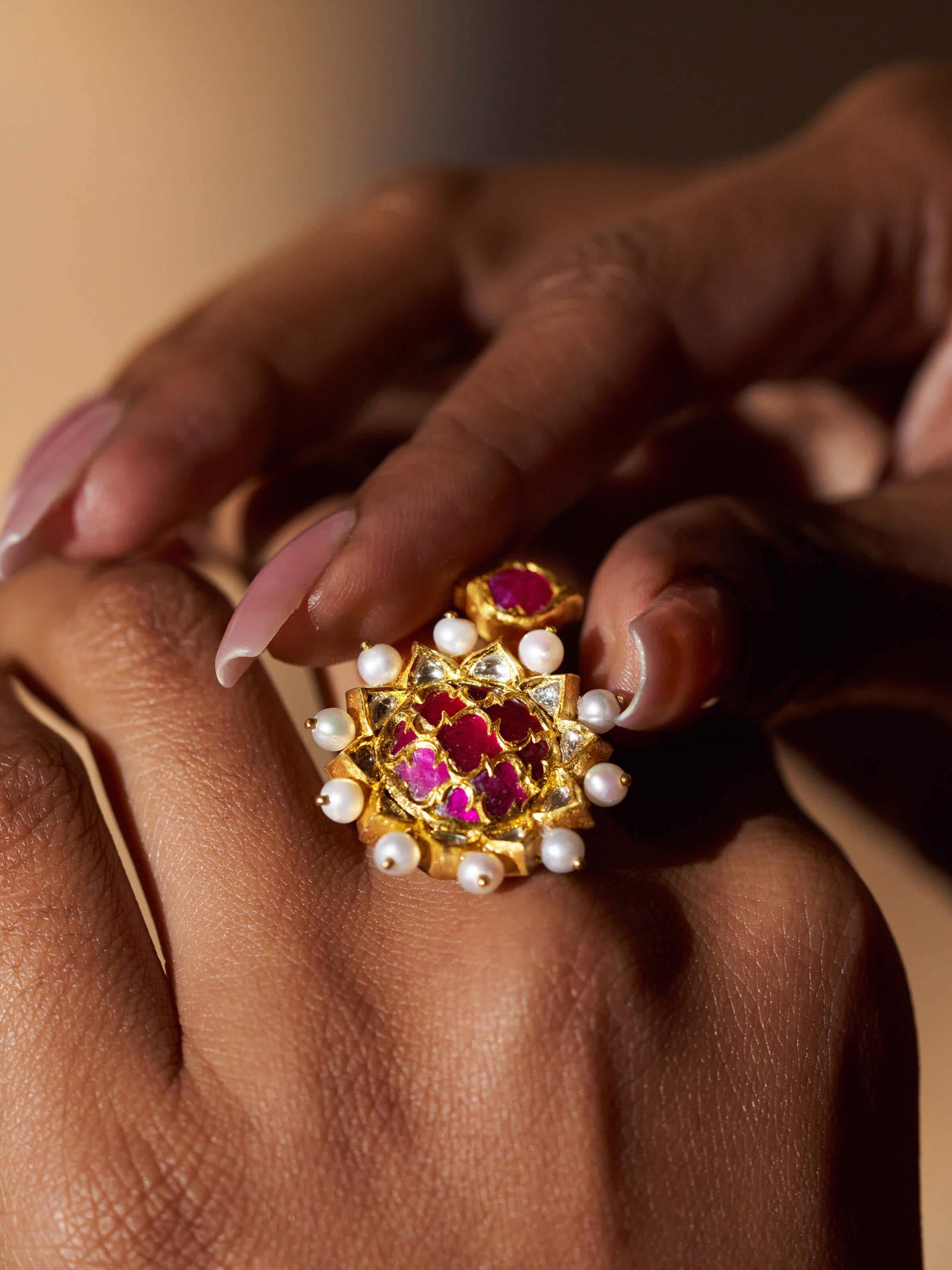 Angled view of Badroom 22 Karat Gold Adjustable Ring emphasizing the polished gold finish and elegant design.