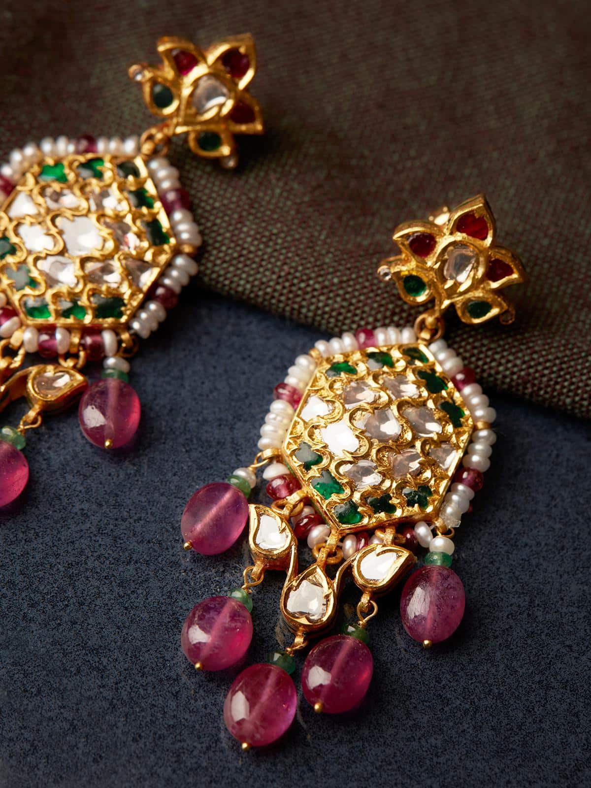 Back view of Badroom 22 Karat Gold Drop Earrings highlighting the earring's secure closure.