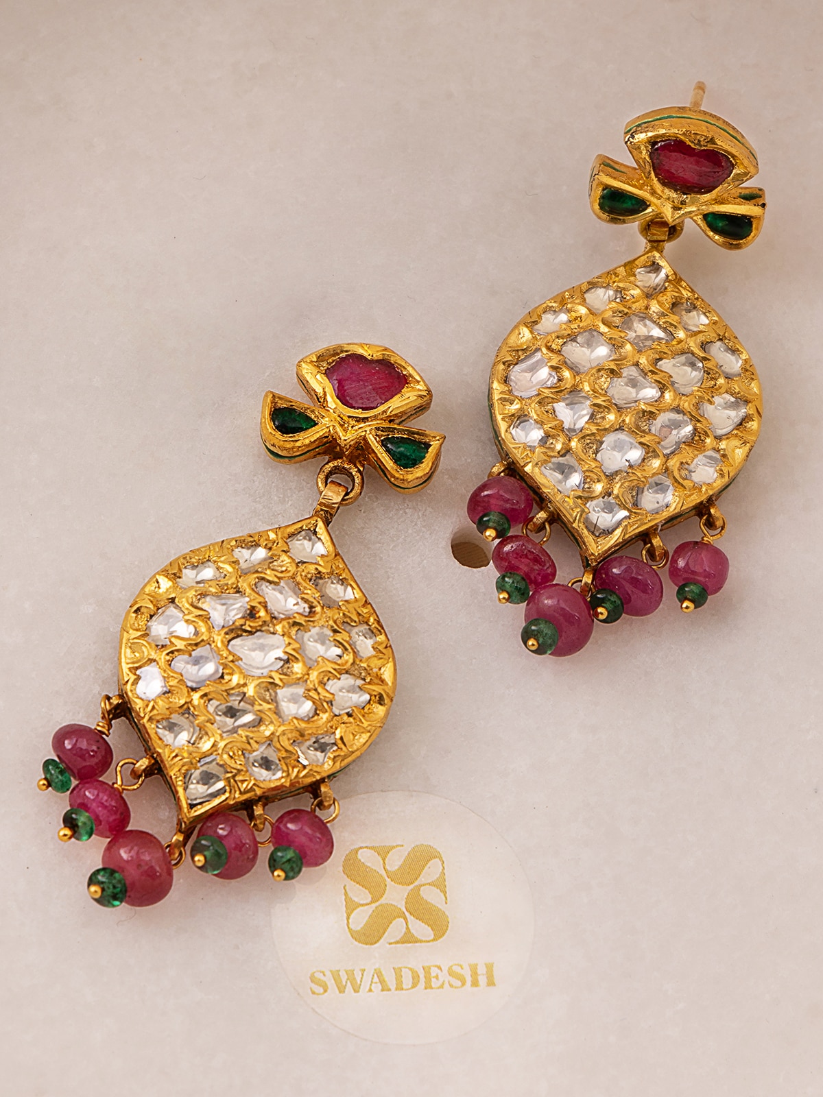 Side view of Badroom 22 karat gold drop earrings highlighting their elegant drop length and craftsmanship.