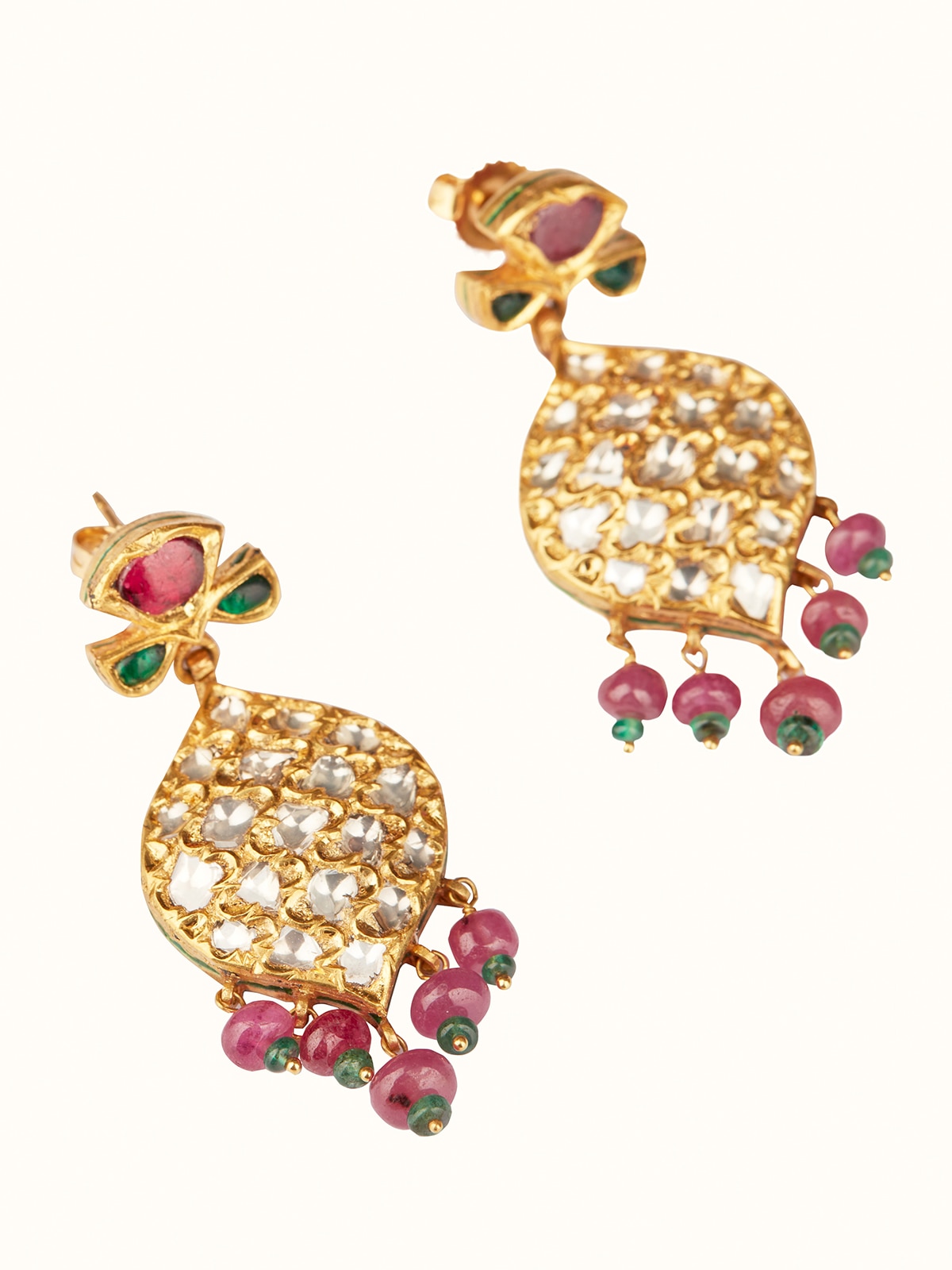 Close-up of Badroom 22 karat gold drop earrings detailing the intricate gold work and design.