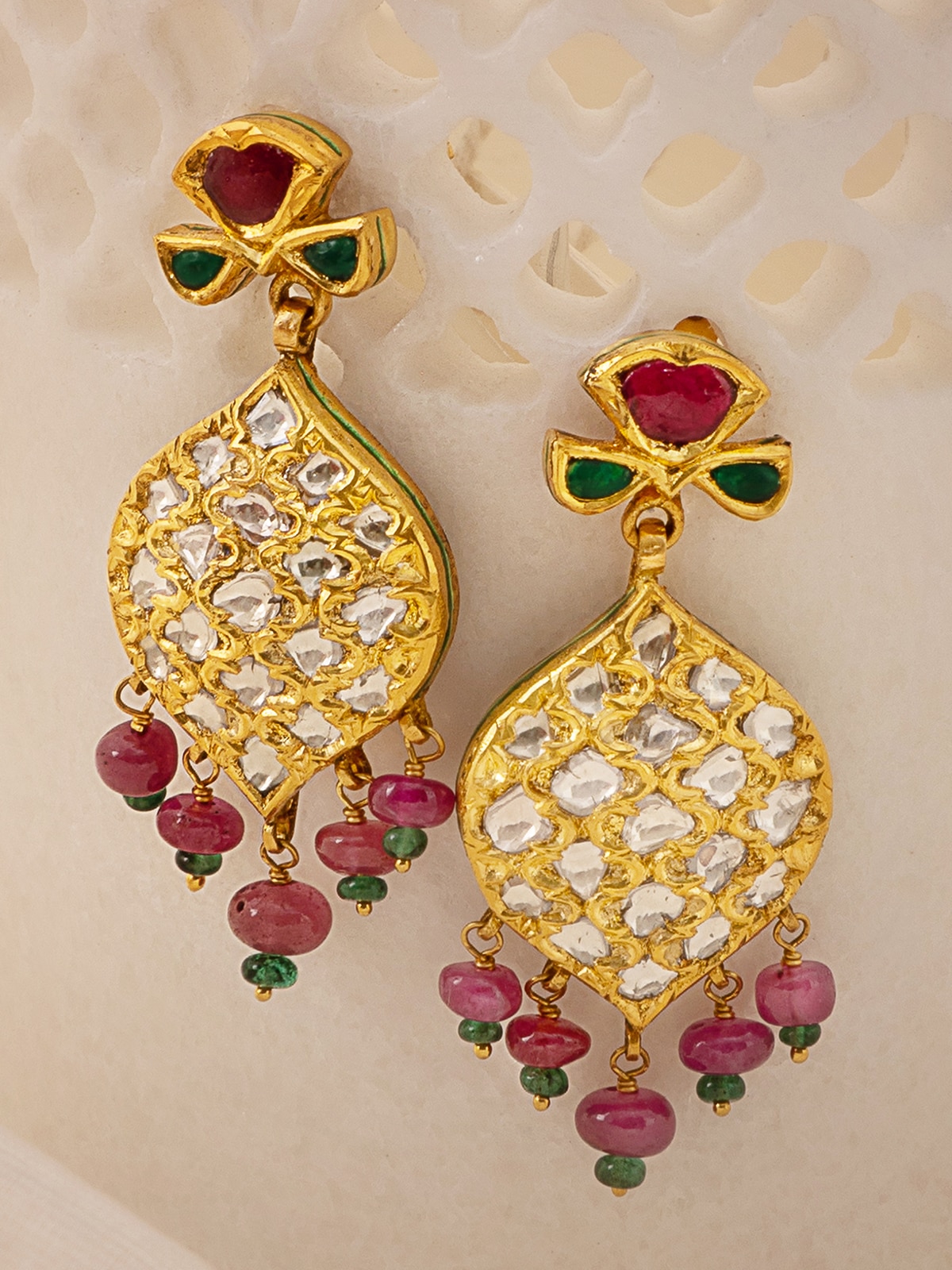 Badroom 22 karat gold drop earrings displayed in a box showing their premium presentation.