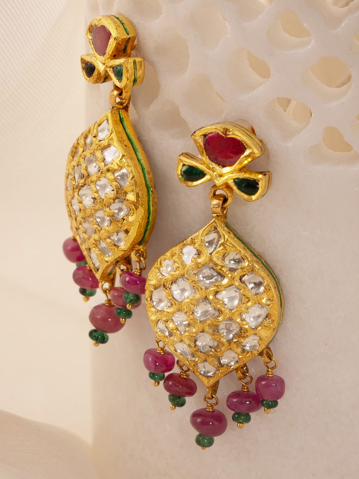 Detailed view of Badroom 22 karat gold drop earrings focusing on the fine gold detailing and elegant design.