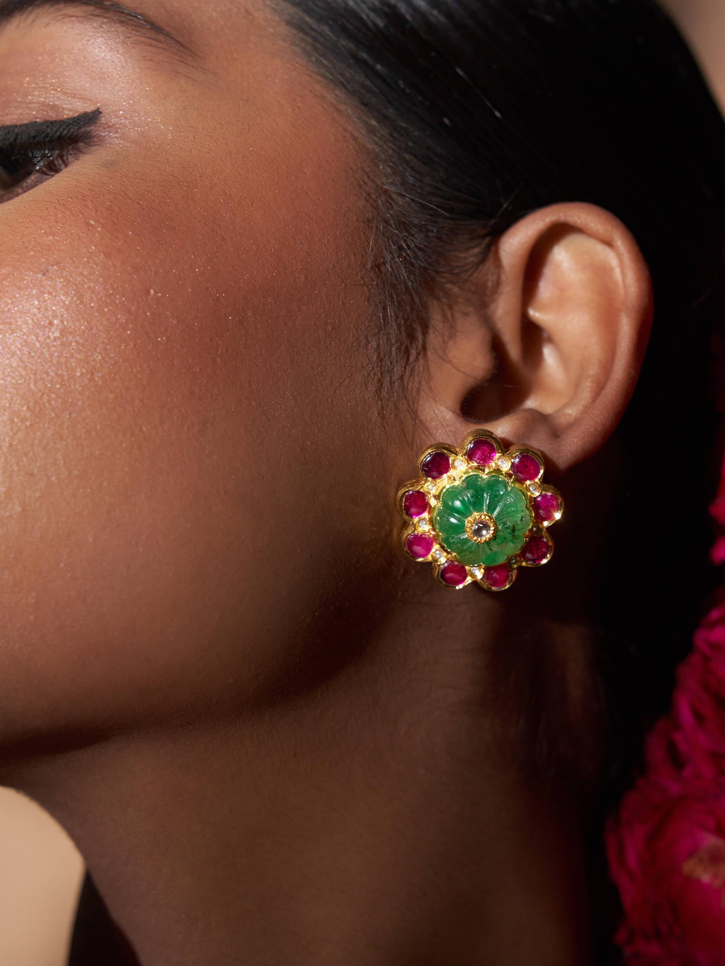 Close-up view of Jadau 18 Karat Gold Studs highlighting the fine gold detail and design