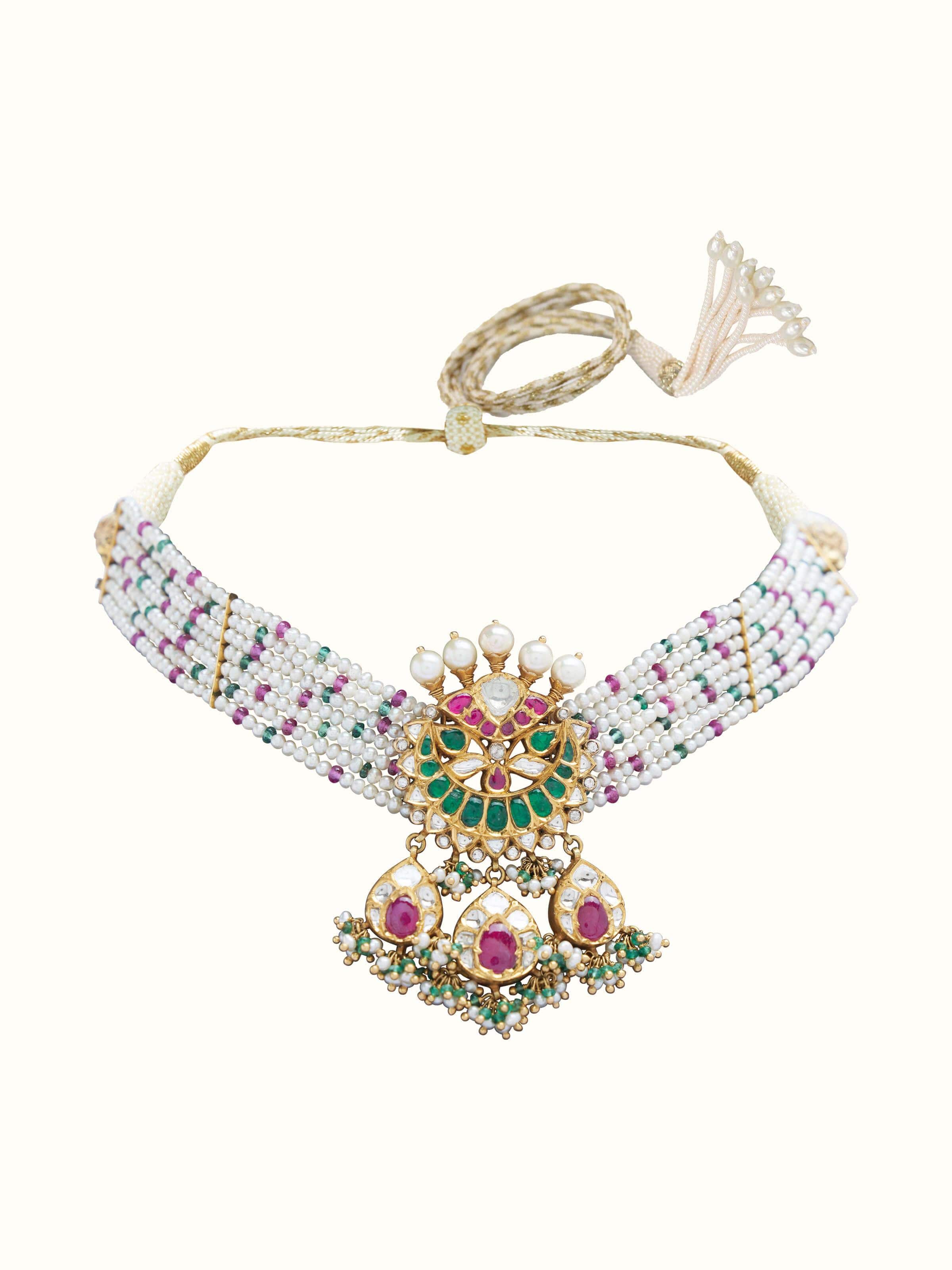 Front view of Jadau 18 karat gold choker adorned with kundan work and traditional Jadau setting.