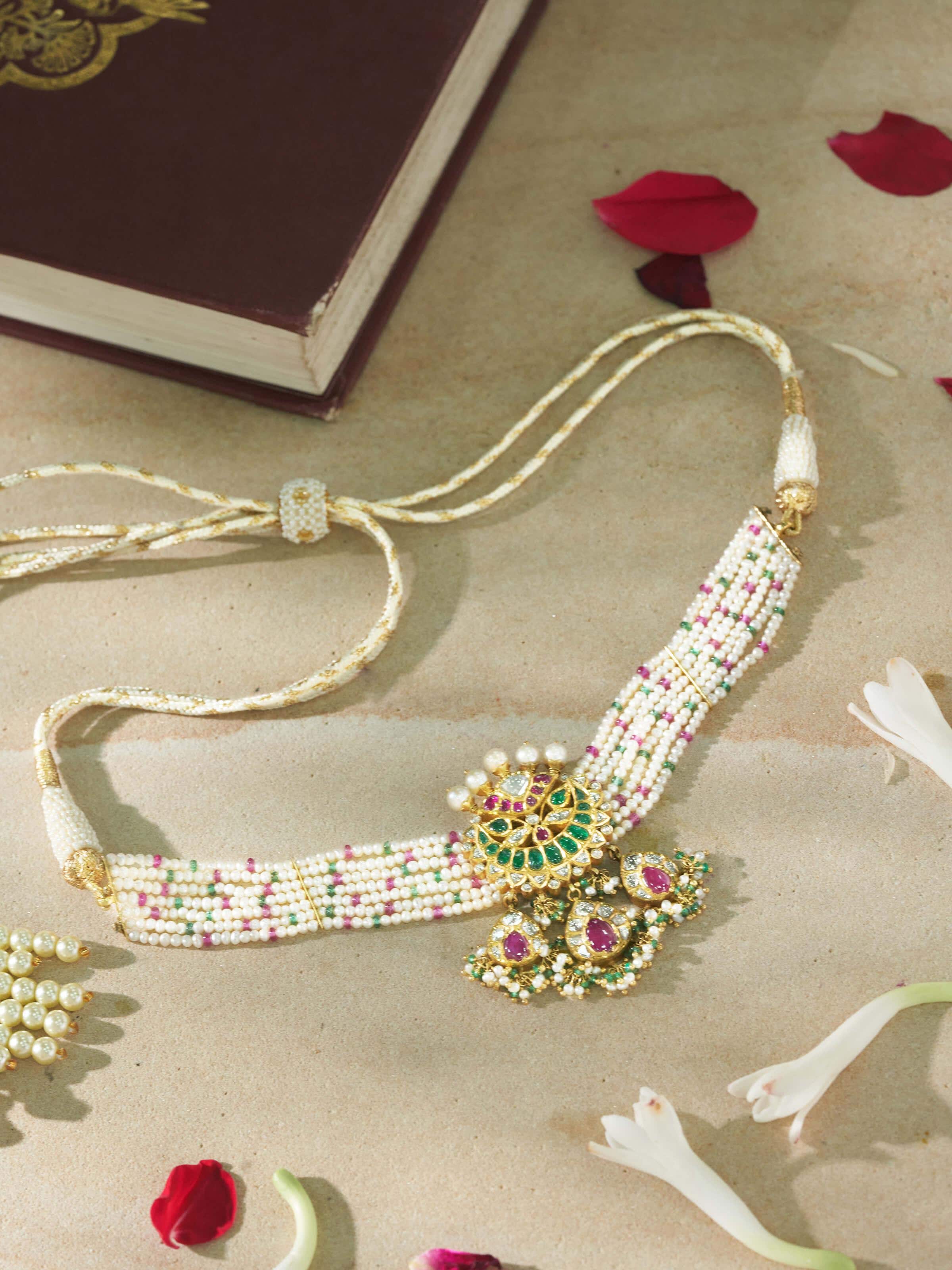 Lifestyle view of Jadau gold choker worn with lehenga, exuding royal ethnic elegance.