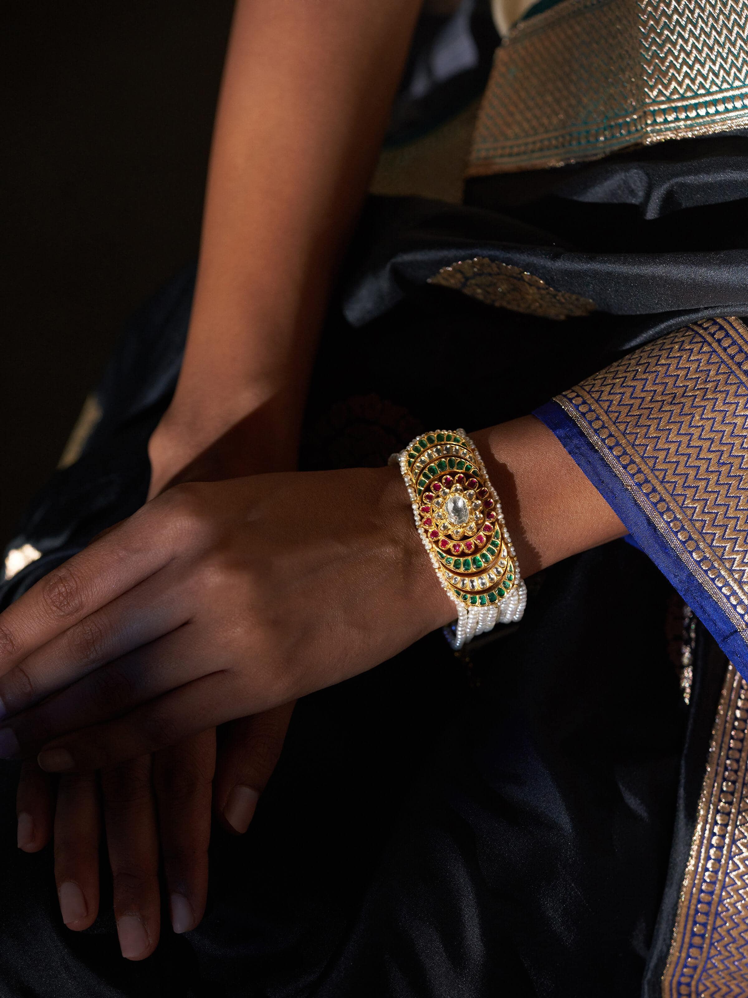 Side view of Jadau 18 Karat Gold Bracelet emphasizing its elegant design and intricate details.