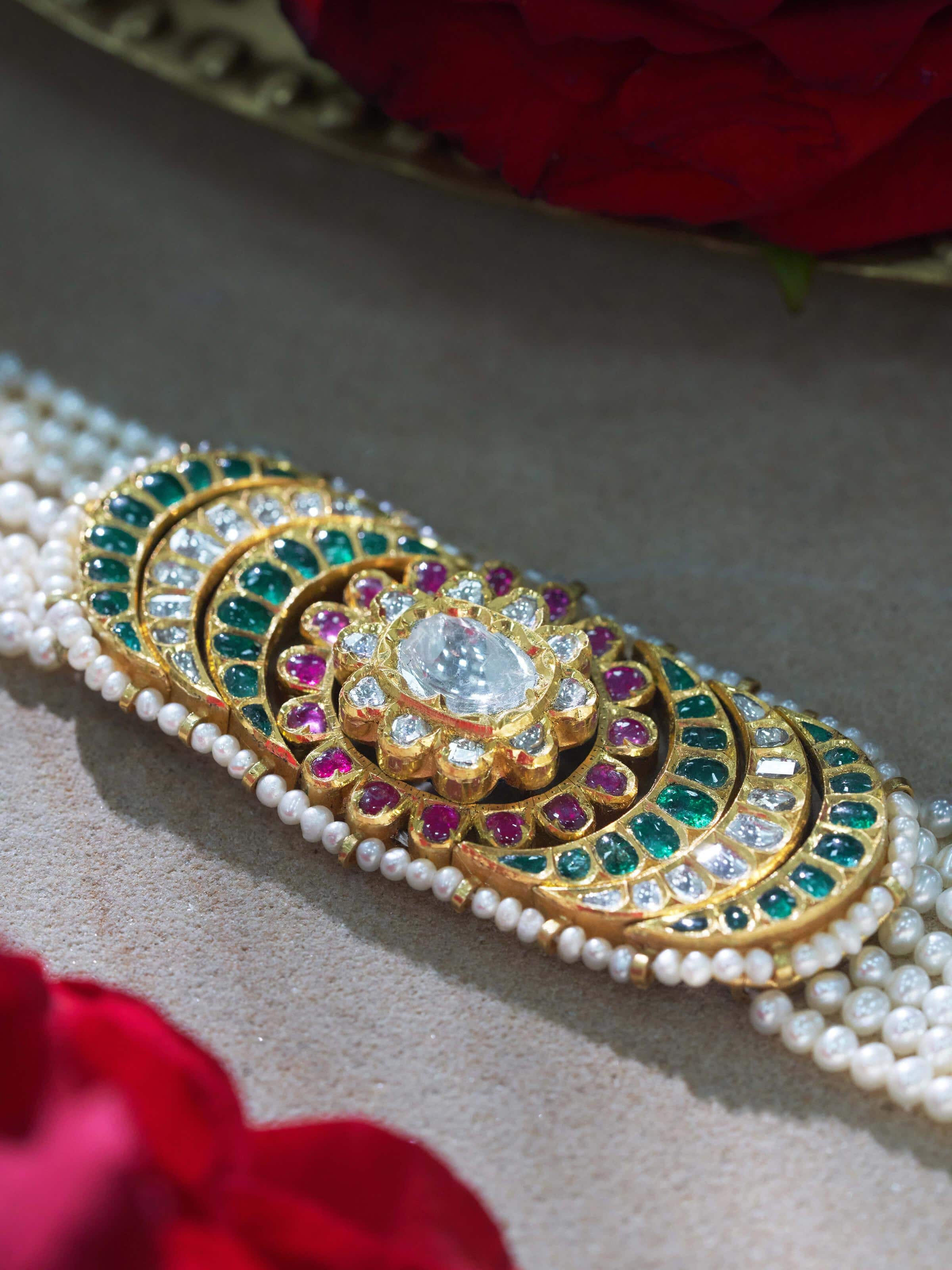 Angled view of Jadau 18 Karat Gold Bracelet showcasing its sophisticated design and gold finish.