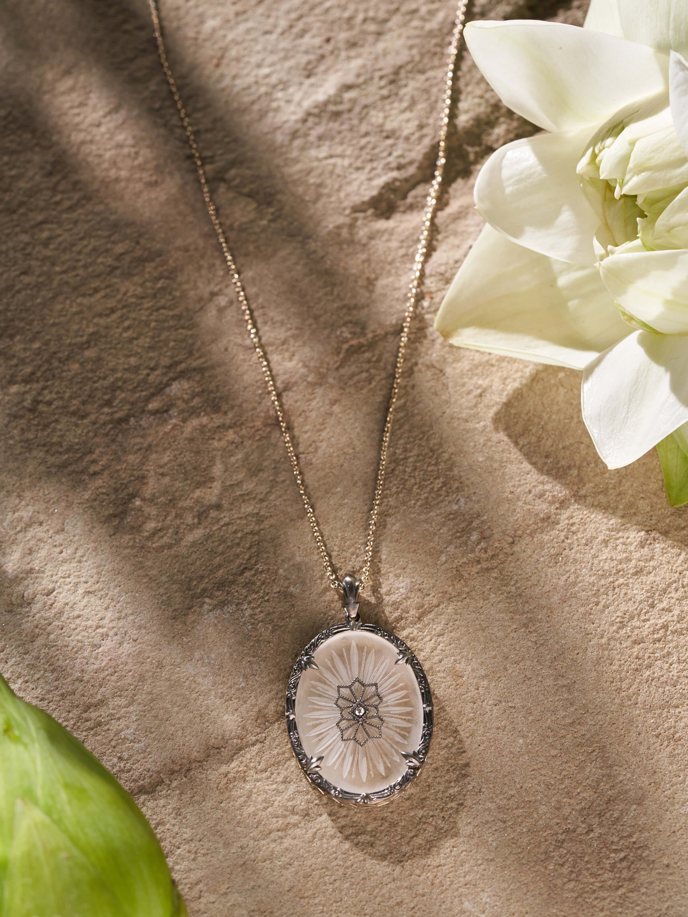 Close-up view of Lapidary 14 Karat Gold Pendant & Chain focusing on the intricate gold details and pendant design.