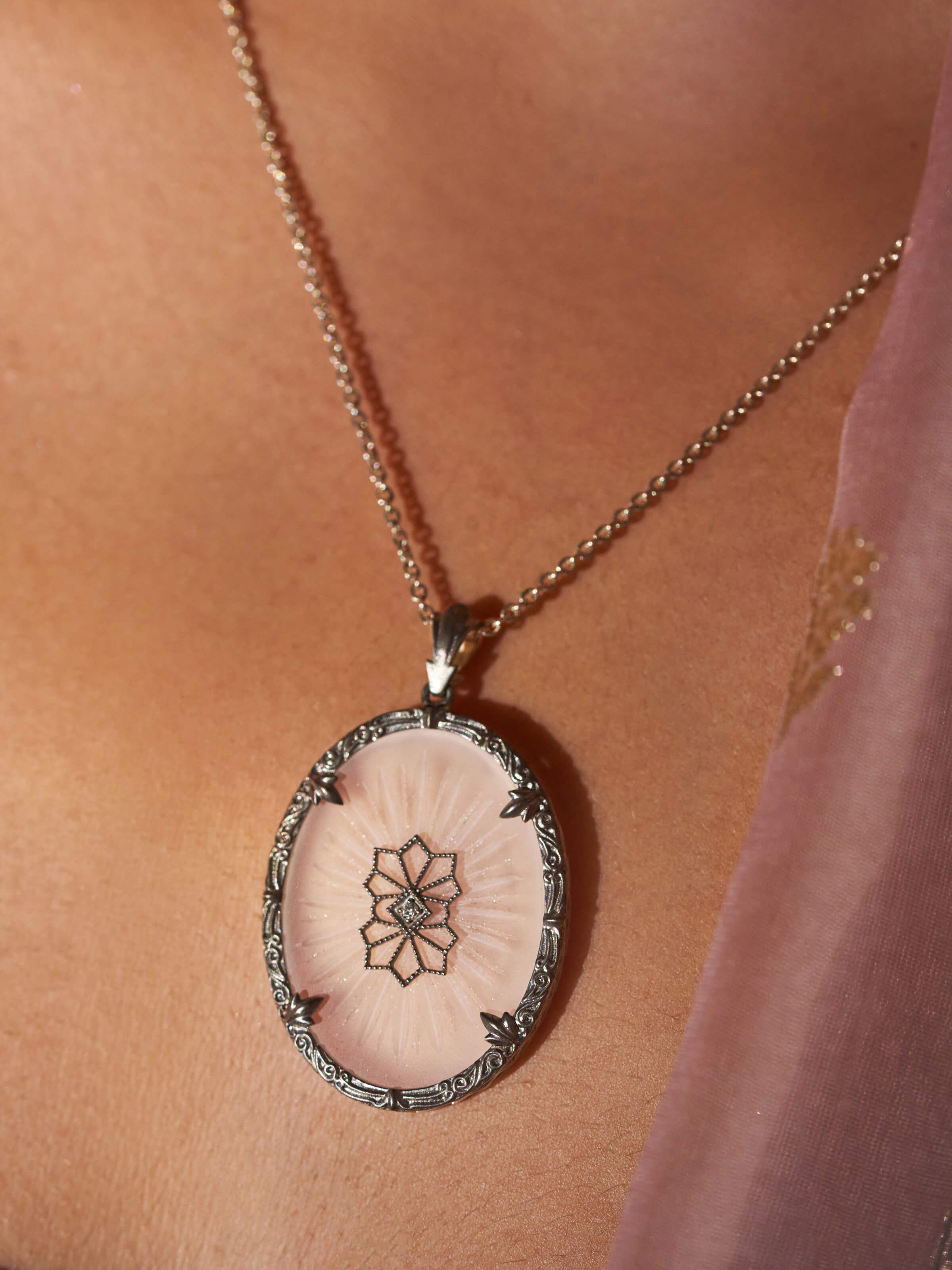 Angled view of Lapidary 14 Karat Gold Pendant & Chain showcasing the pendant's design and chain's quality.