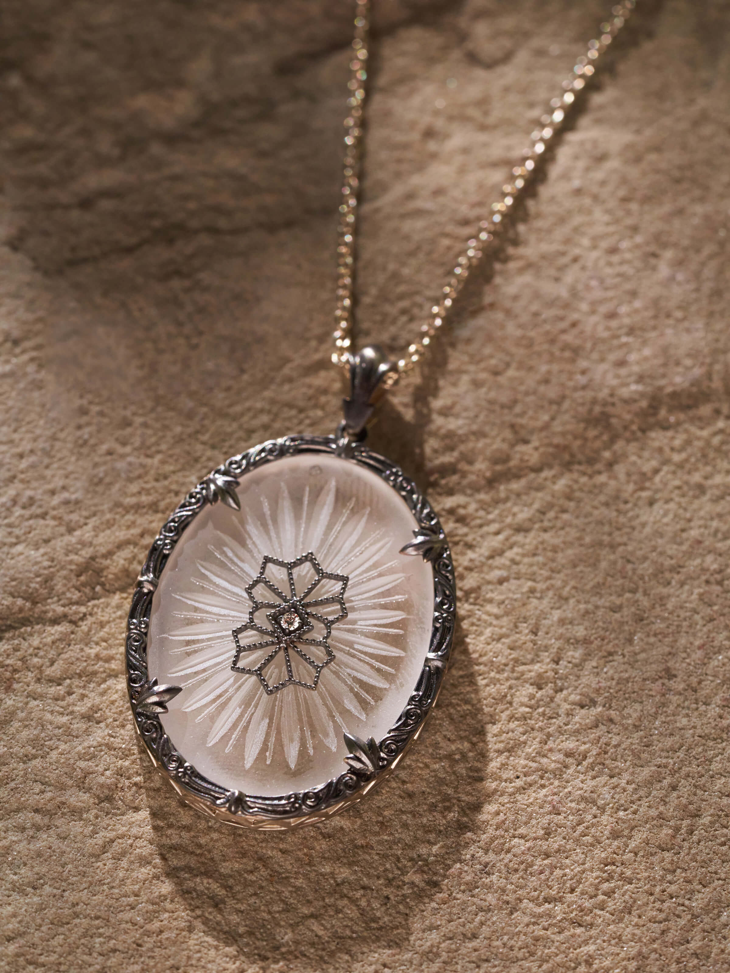 Detailed view of Lapidary 14 Karat Gold Pendant & Chain focusing on the intricate design and gold finish.