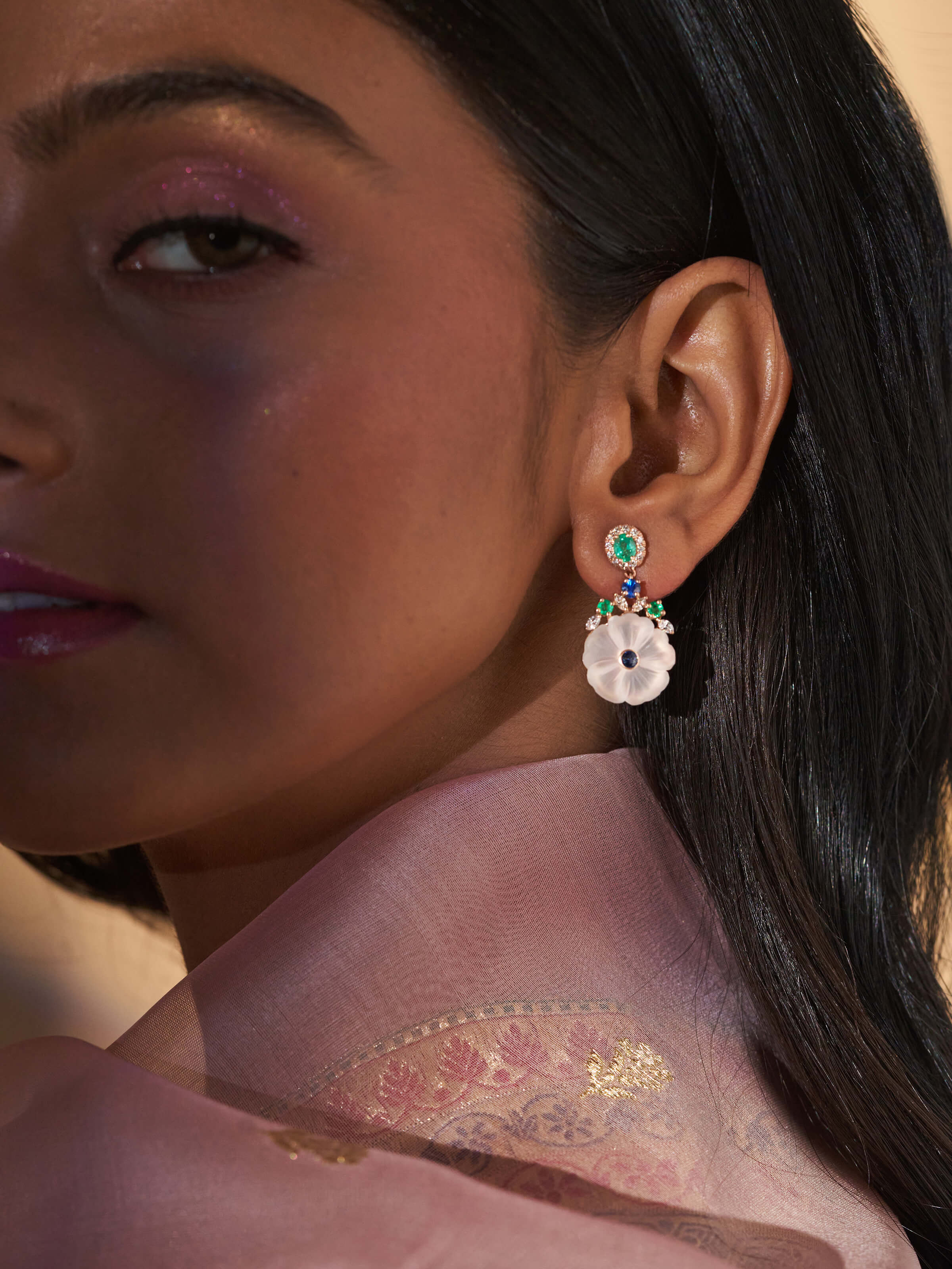 Close-up view of Lapidary 14 karat gold drop earrings focusing on intricate design and premium materials