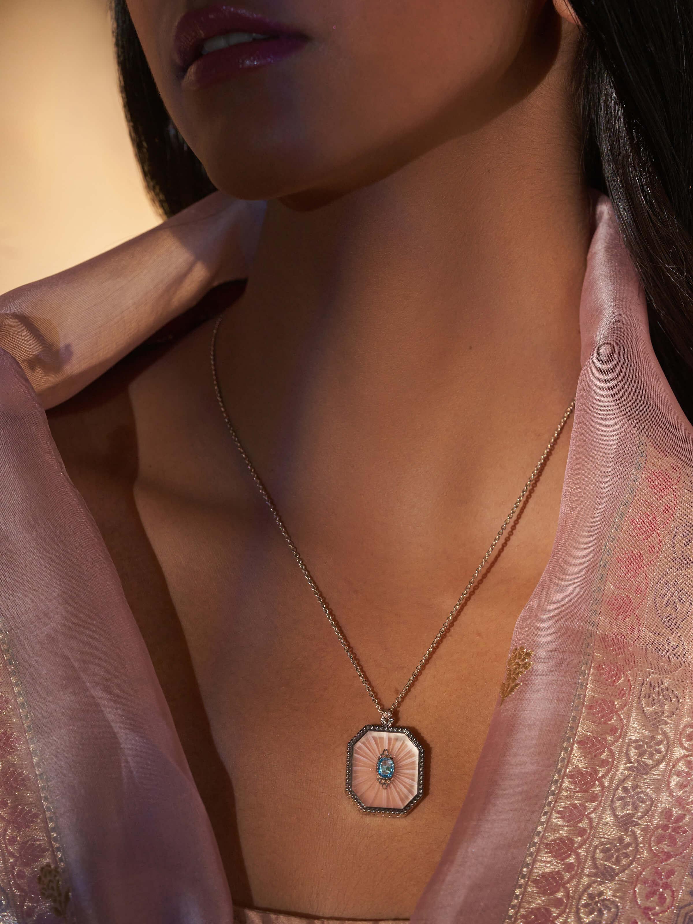 Alternate lifestyle view of Lapidary pendant highlighting chain and gemstone brilliance.