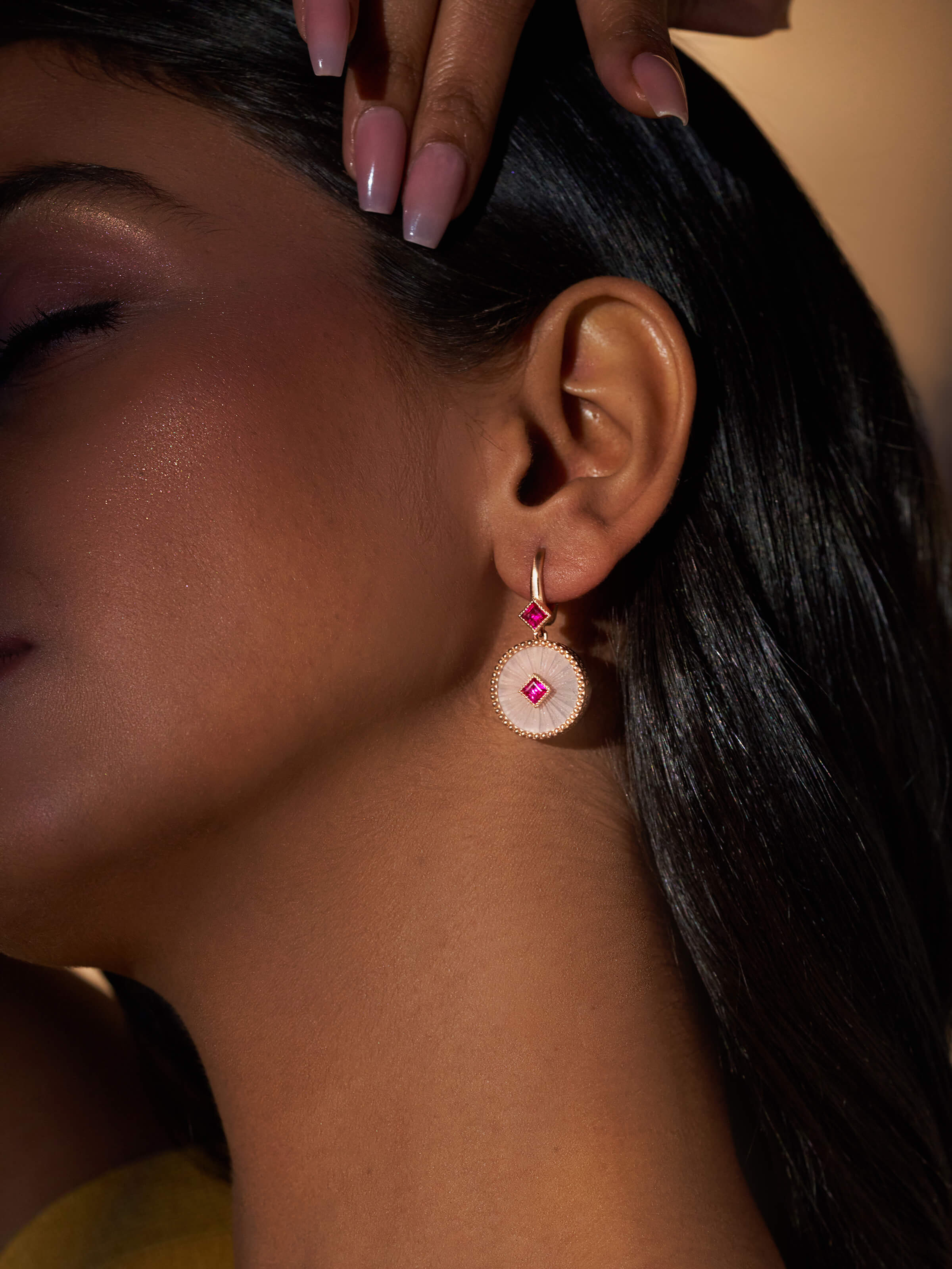 Close-up view of Lapidary 14 karat gold drop earrings focusing on their intricate design and elegance