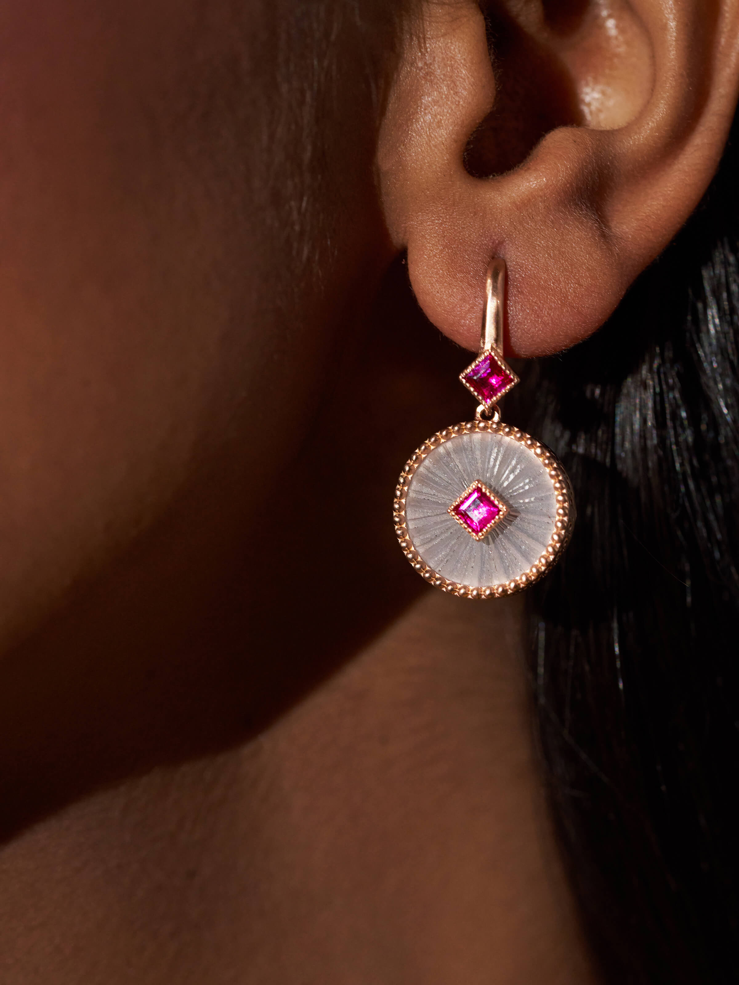 Angled view of Lapidary 14 karat gold drop earrings showcasing their stylish drop and fine details