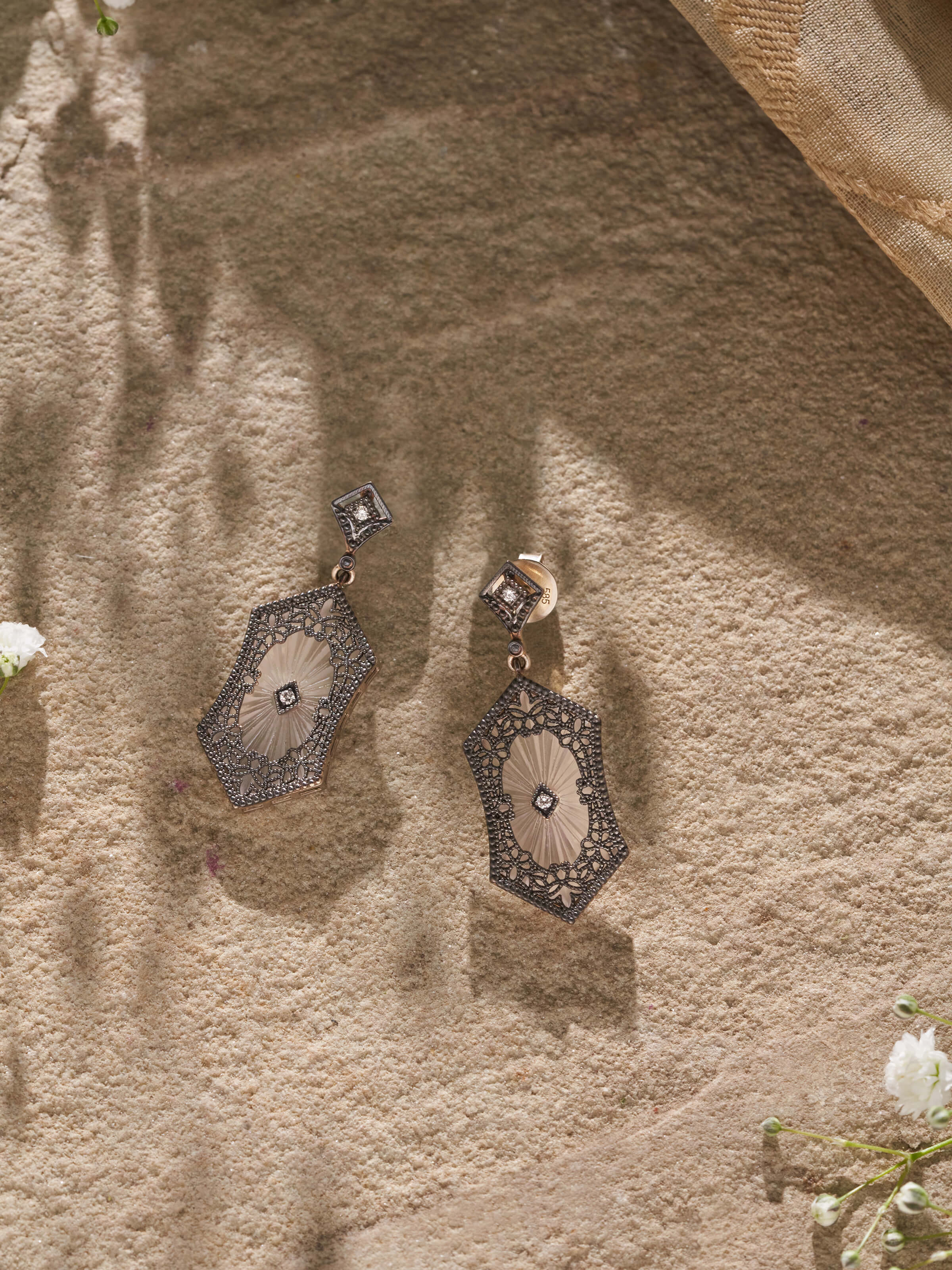 Side view of Lapidary 14 karat gold drop earrings showcasing detailed goldwork and sophisticated design