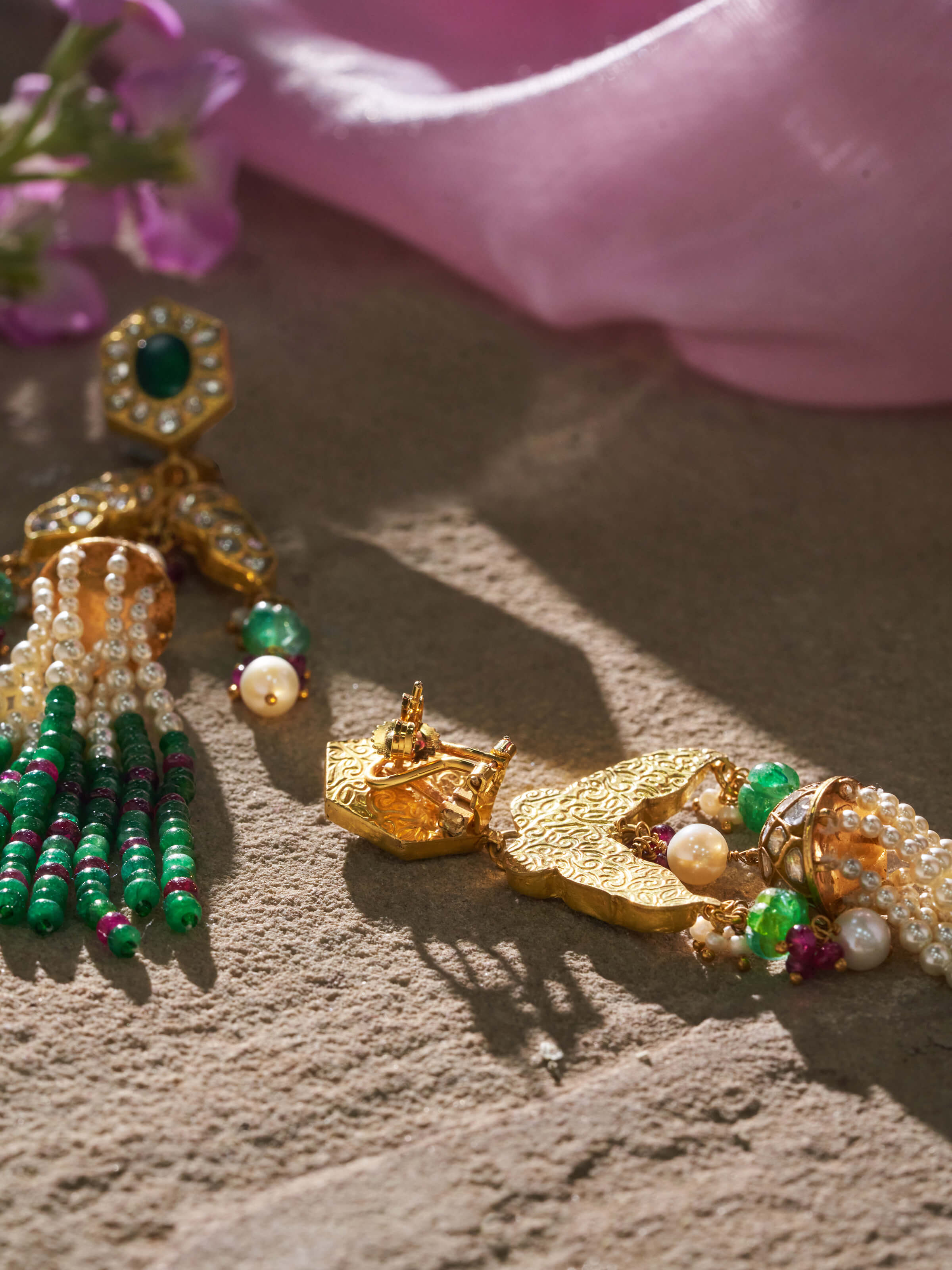 Angled view of Thappa 22 Karat gold earrings highlighting design depth and rich finish.