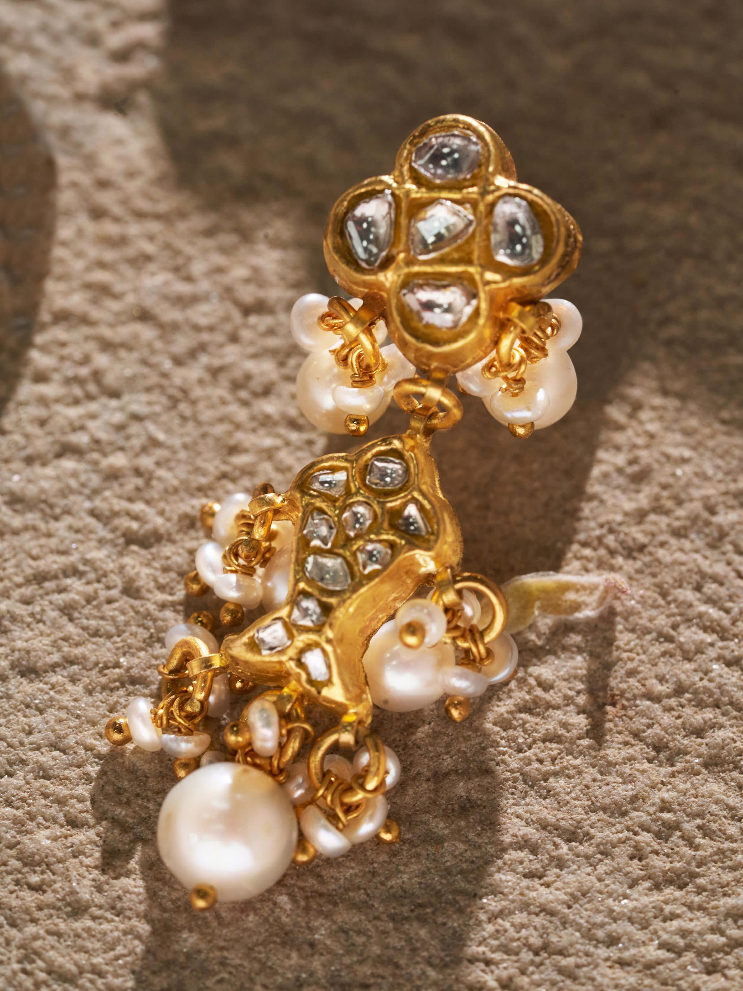 Detailed view of Thappa 22 Karat gold drop earrings highlighting the gold quality and design.