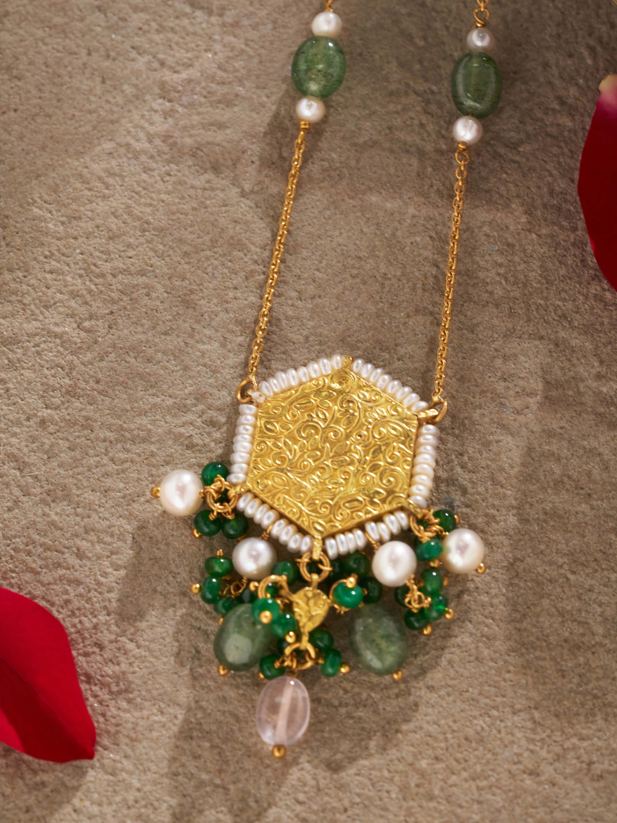 Angled view highlighting the circular motif and hammered gold finish