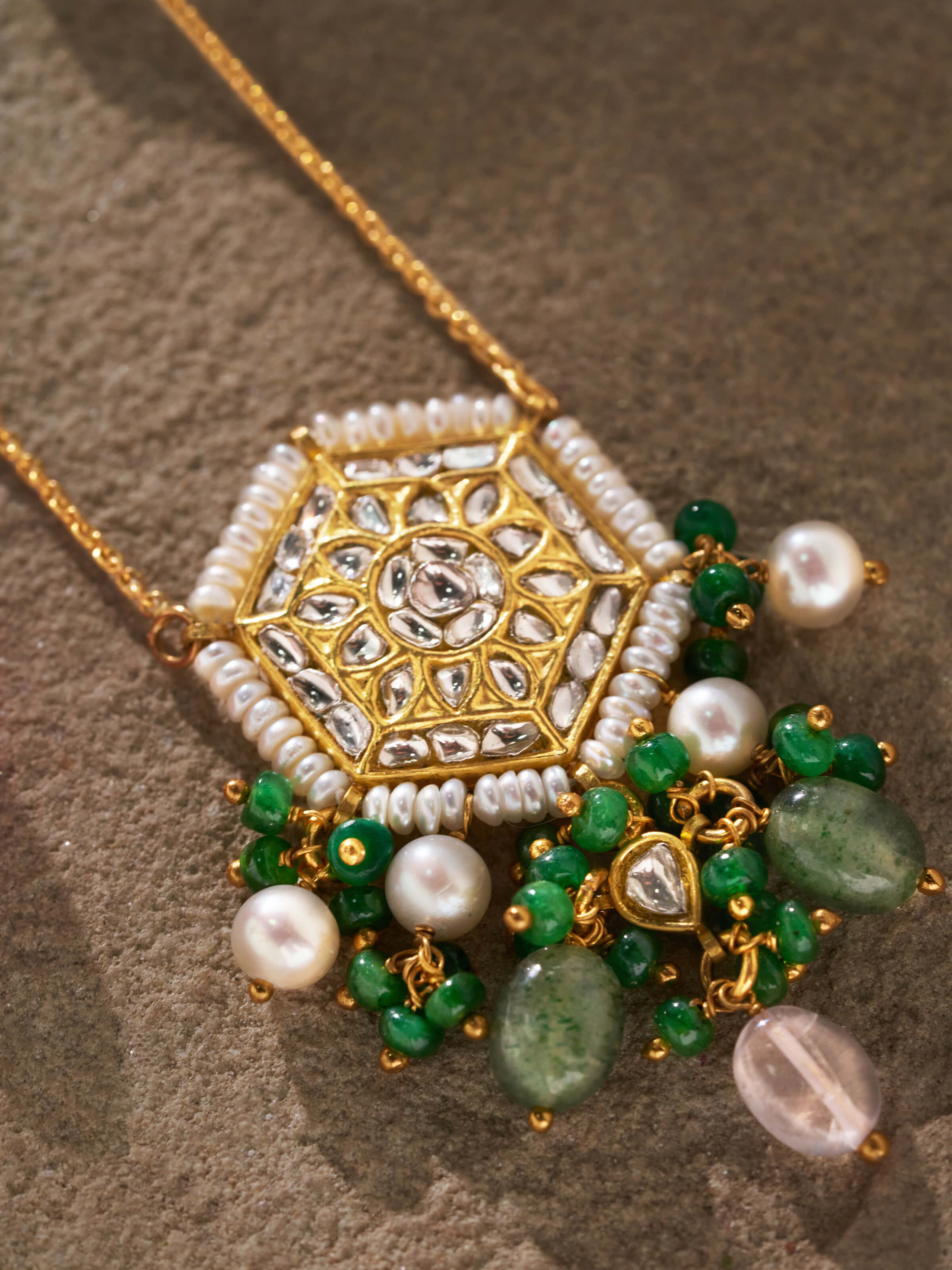 Detail shot showing thappa embossing and refined pendant frame