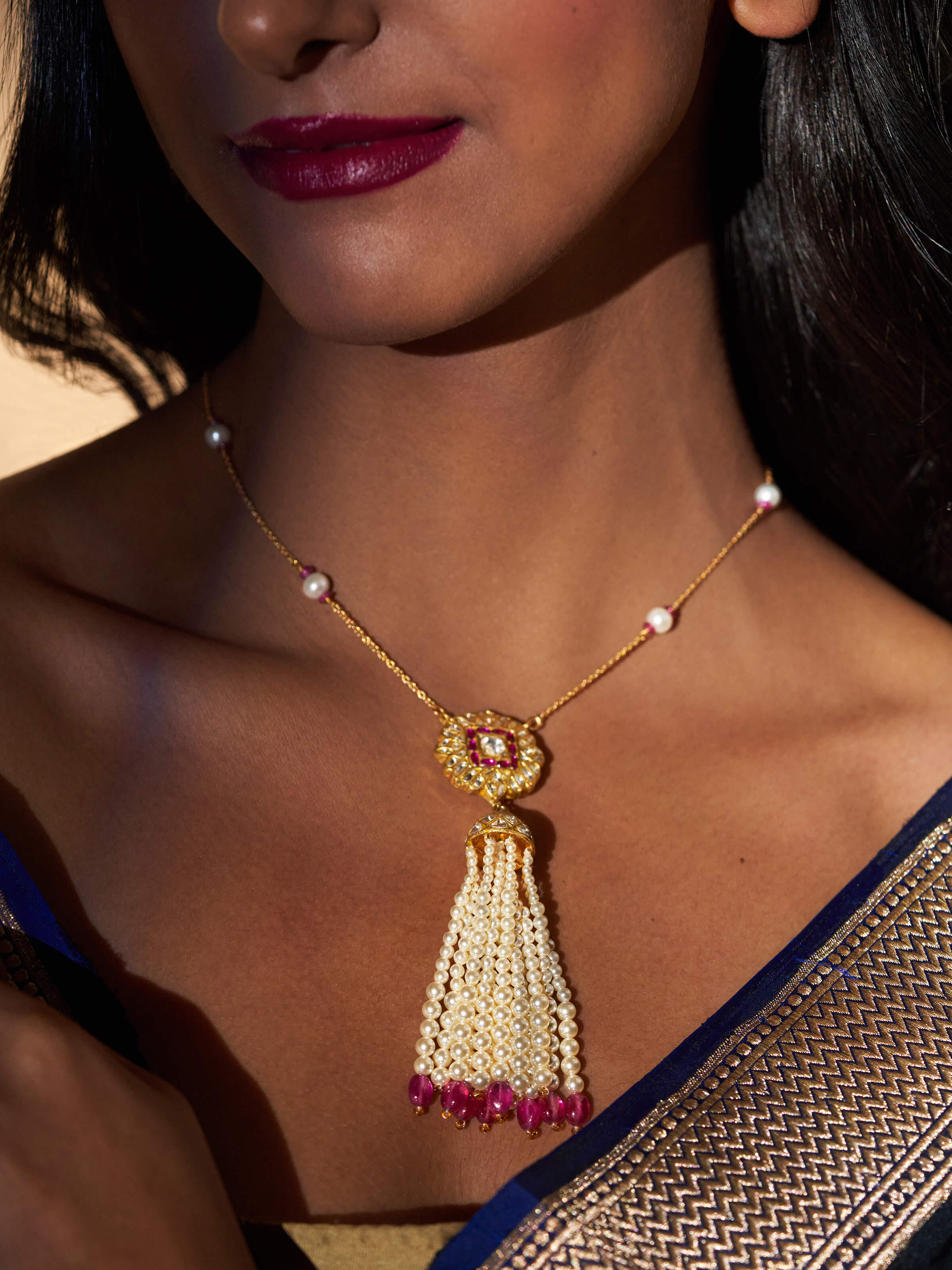 Lifestyle shot showing the pendant worn elegantly to highlight its shine and elegance