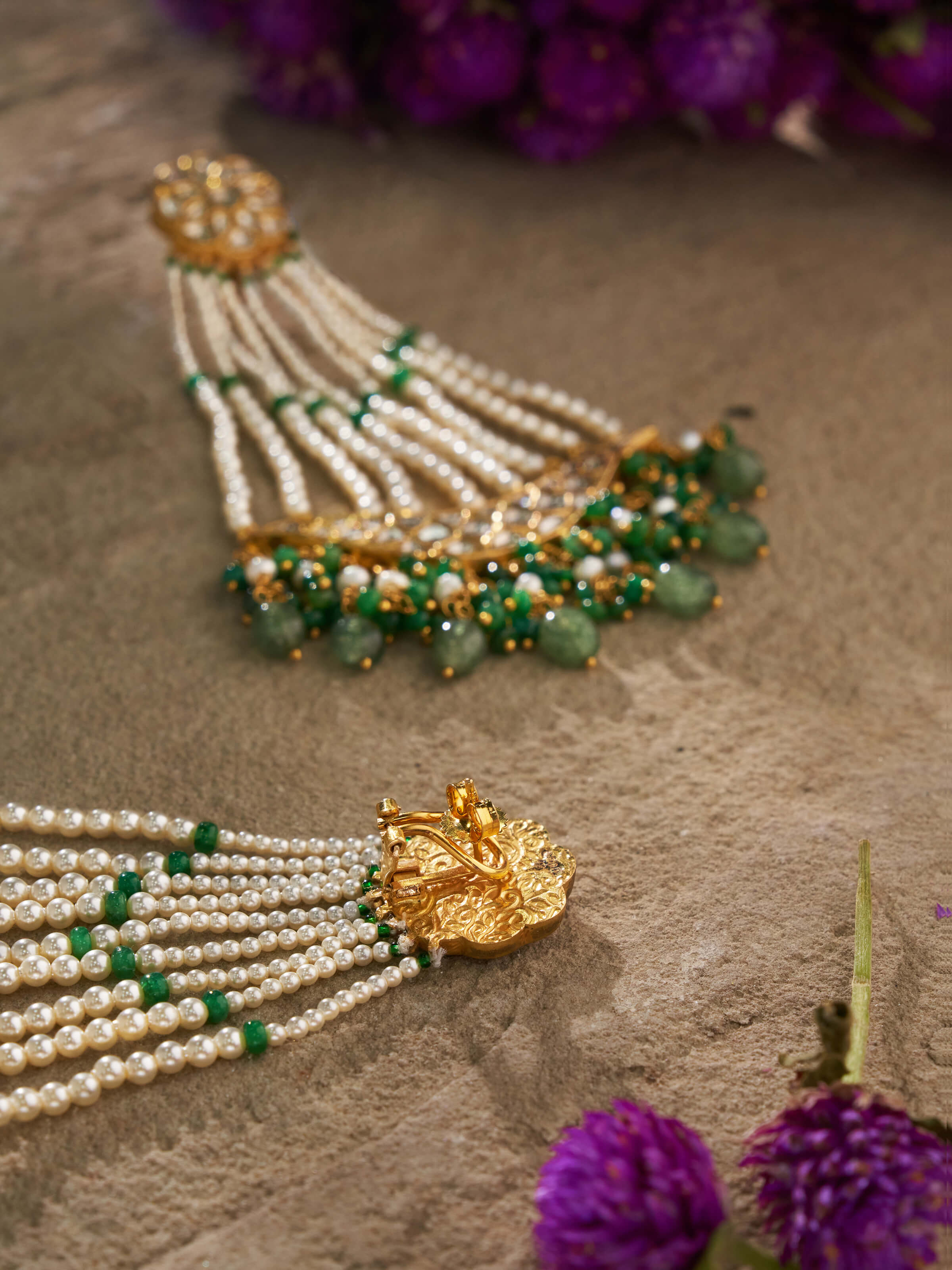 Back view showing hooks and smooth gold finishing of drop earrings