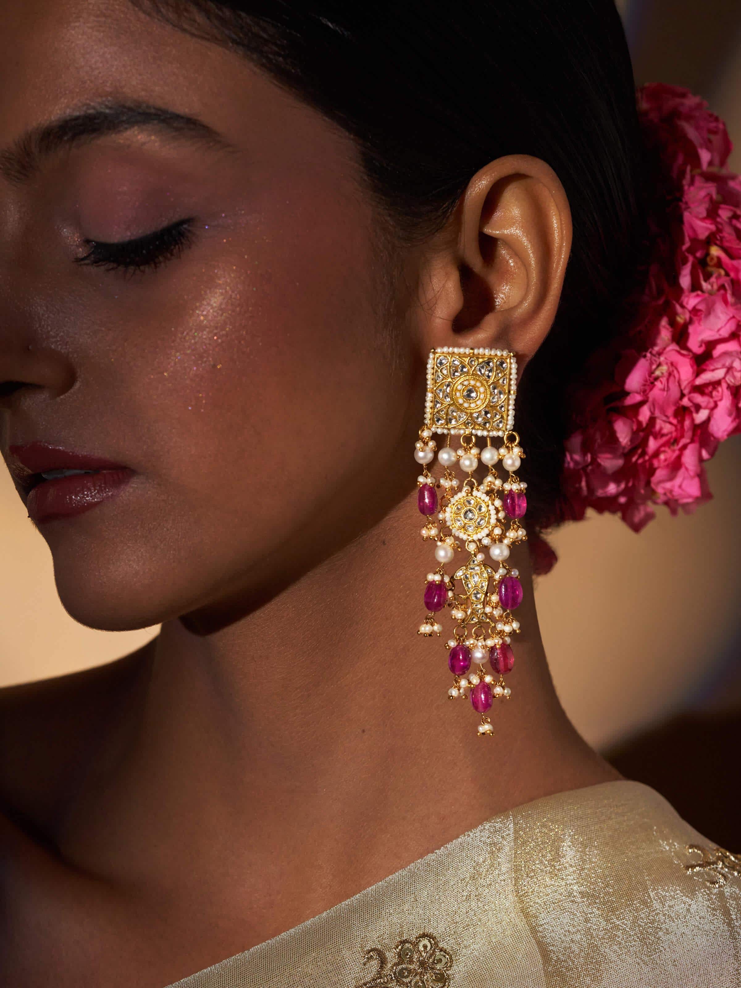 Close-up view of Thappa 22 karat gold drop earrings showcasing their detailed craftsmanship.