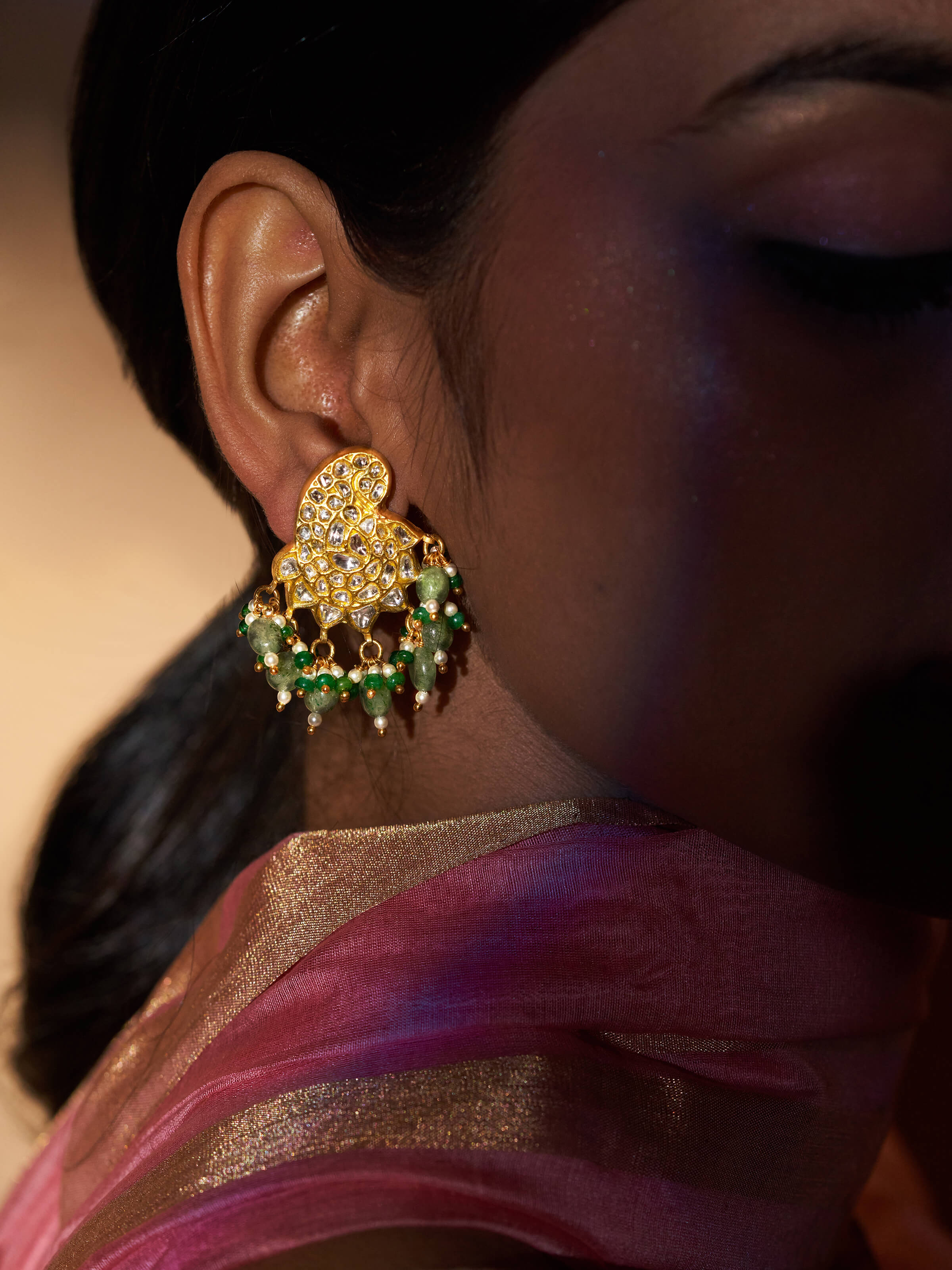 Side view of Thappa 22 Karat Gold Drop Earrings highlighting the refined gold detailing and delicate drop shape.