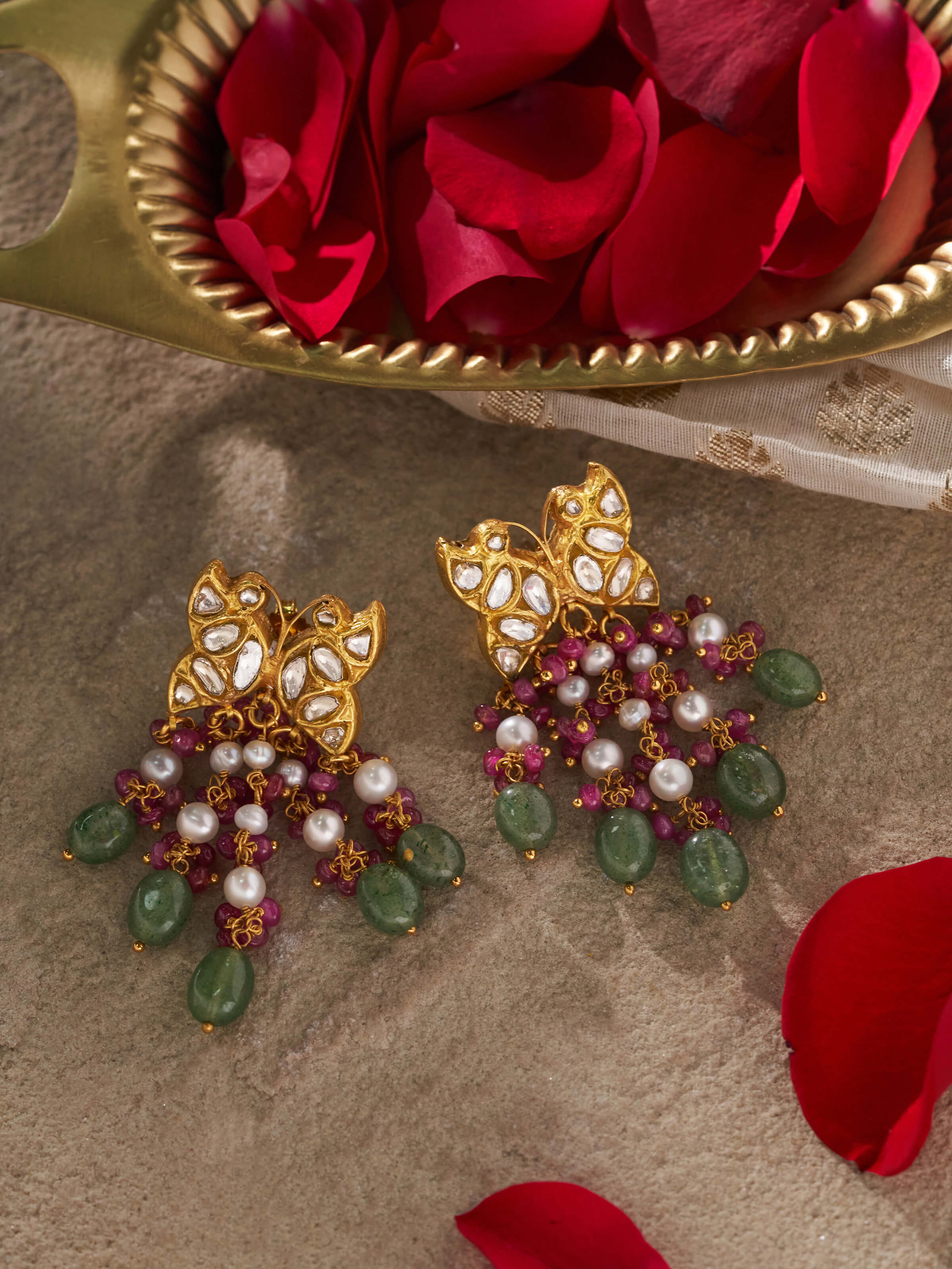 Side view of Swadesh Thappa 22 Karat Gold Drop Earrings highlighting elegant drop design and polished gold surface