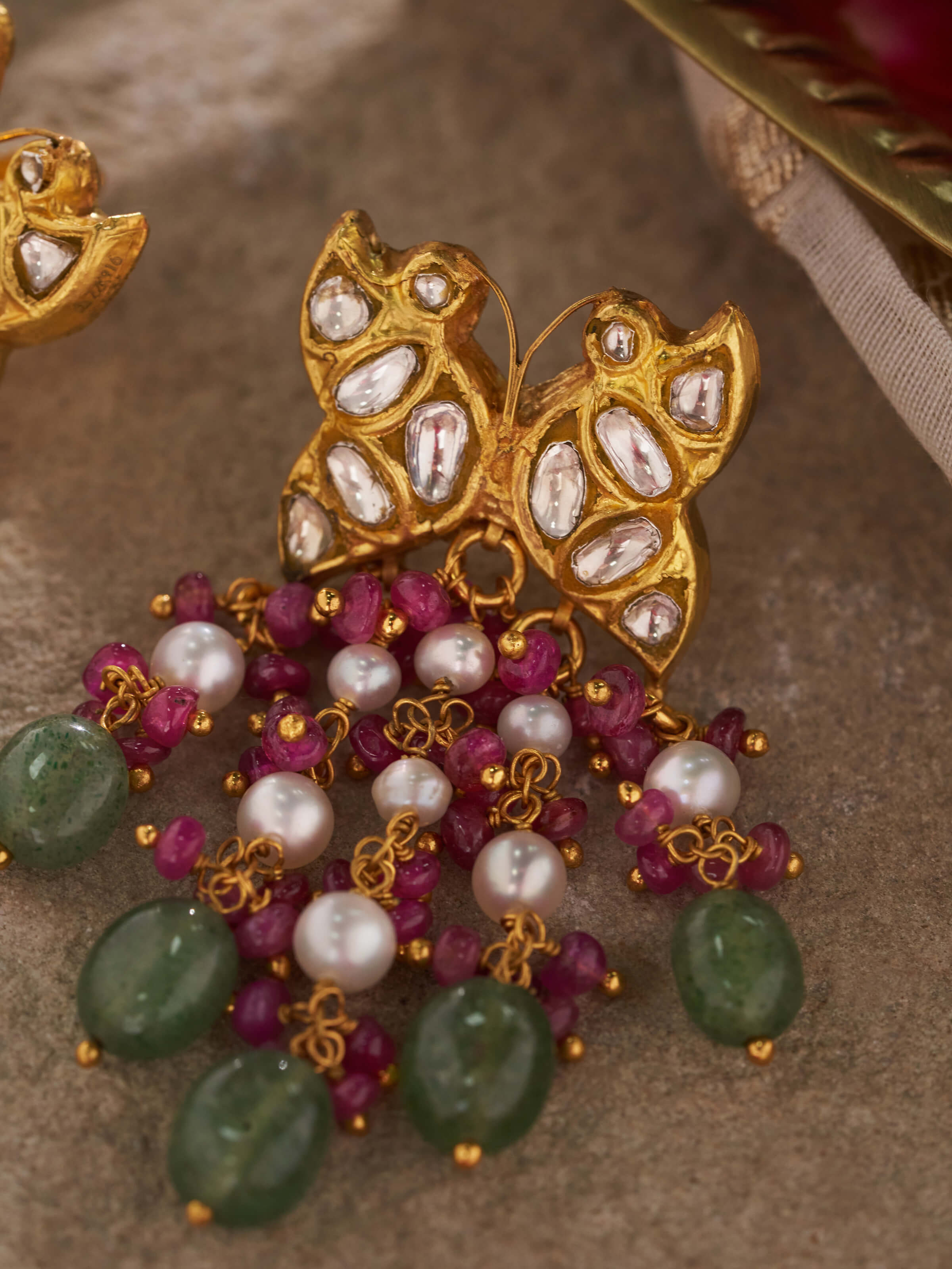 Detailed view of Thappa 22 Karat Gold Drop Earrings by Swadesh showcasing ornate design and luxurious gold sheen