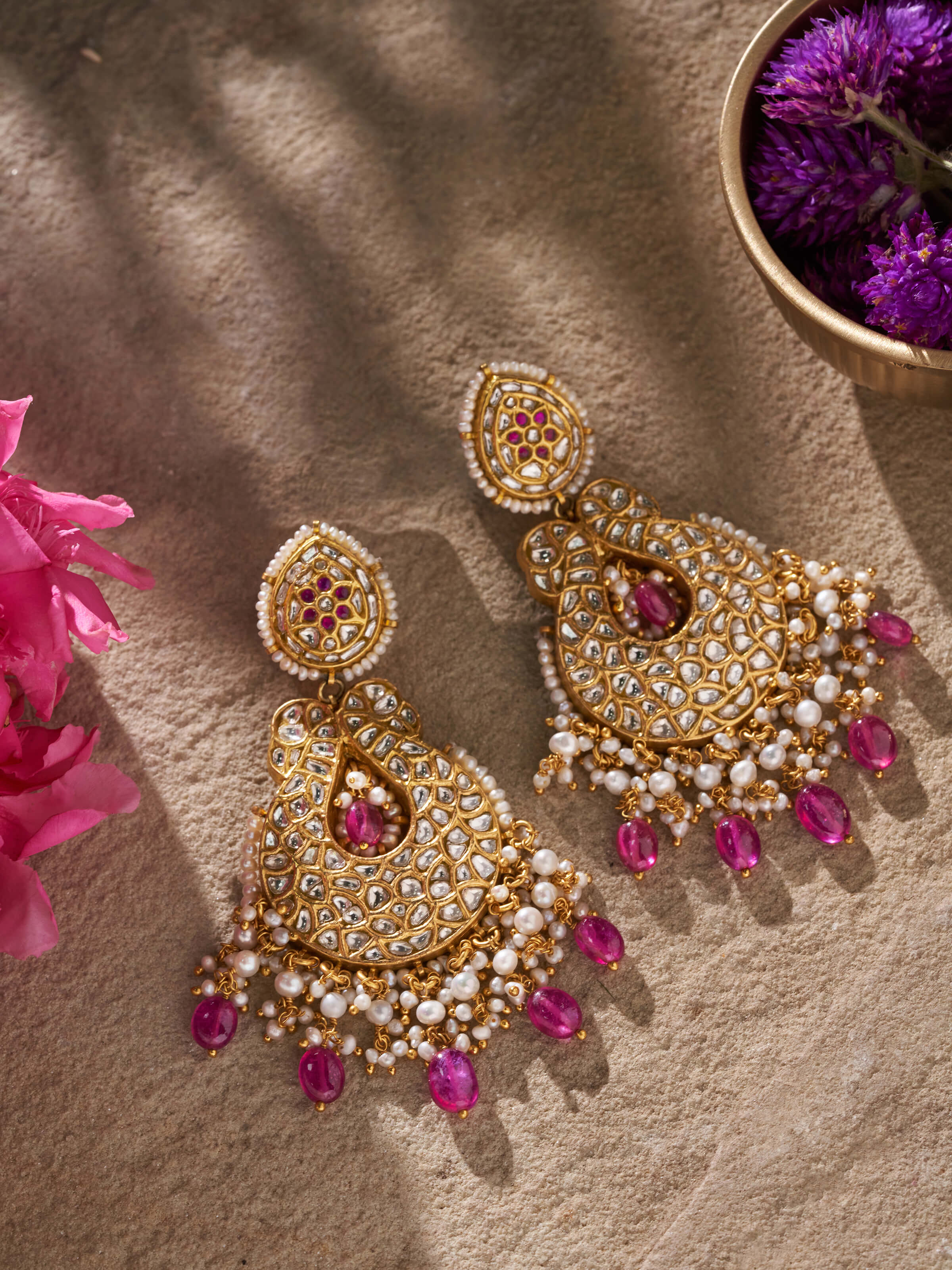 Side view of 22 karat gold drop earrings showcasing their elegant design and craftsmanship