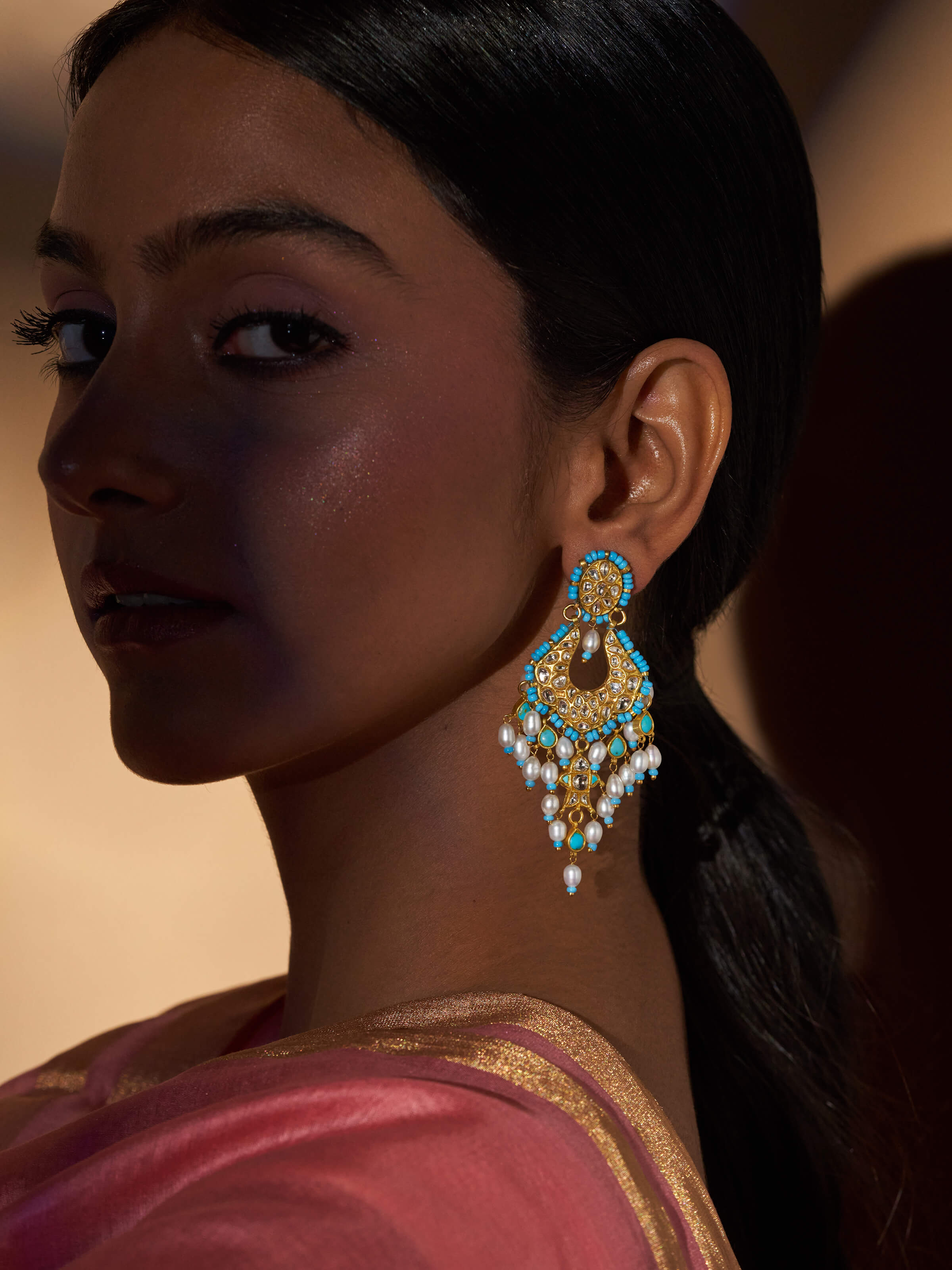 Side view of Thappa 22 Karat Gold Drop Earrings showcasing the elegant drop shape and detailed goldwork.