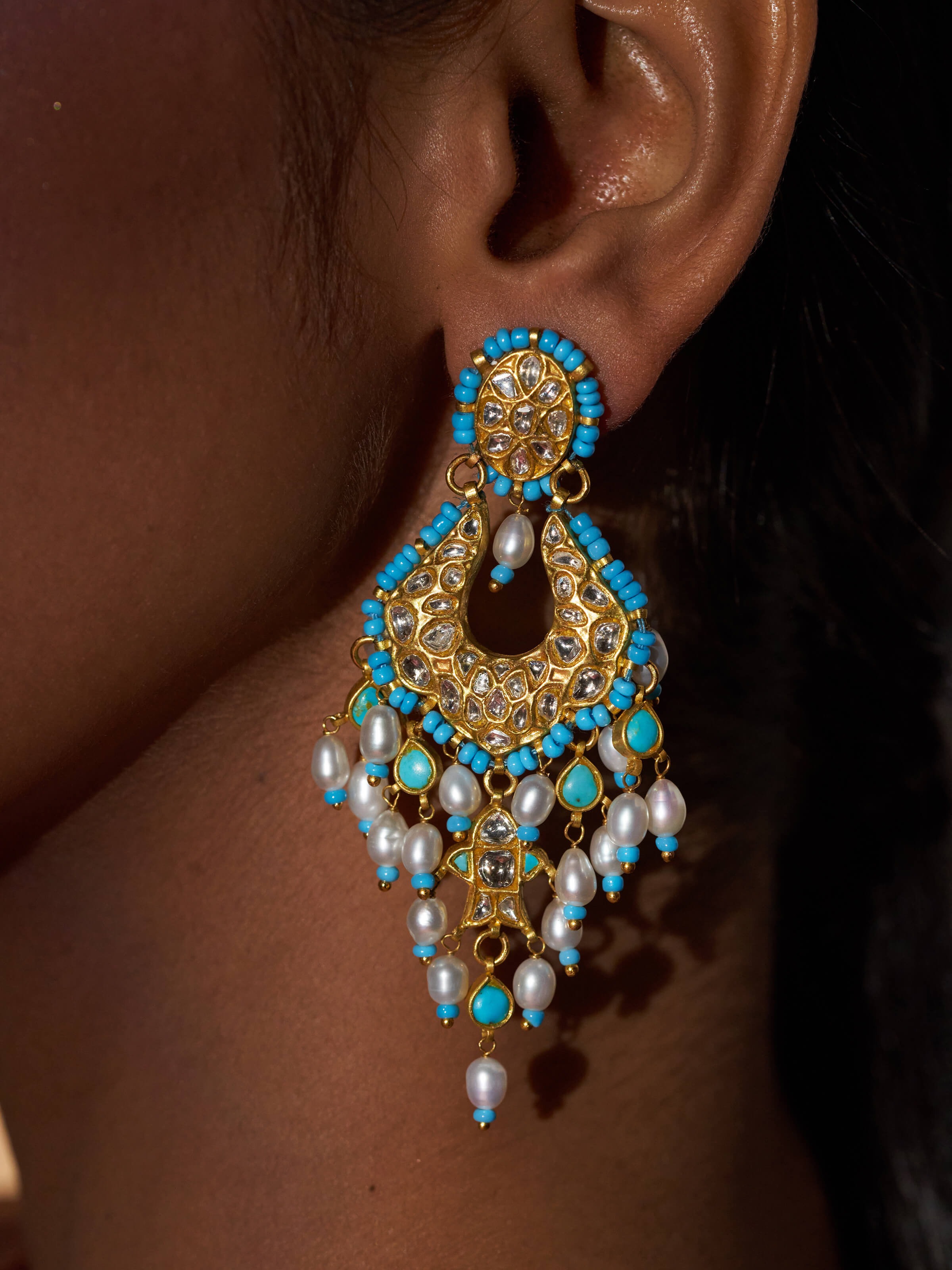 Angled view of Thappa 22 Karat Gold Drop Earrings emphasizing the refined gold finish and elegant drop design.