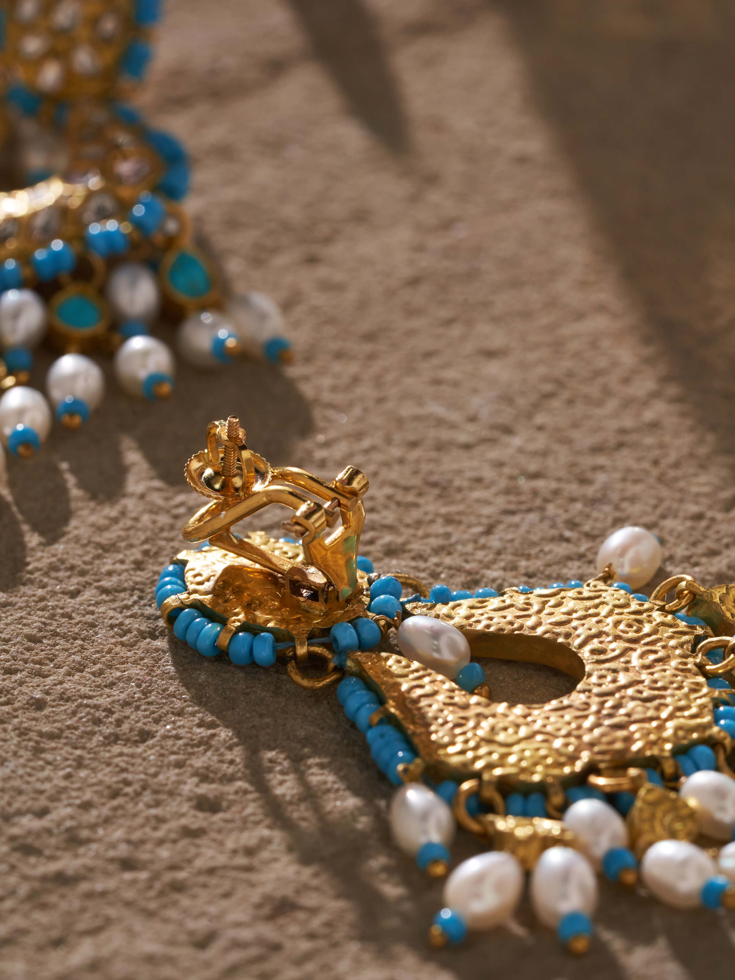 Close Side view of Thappa 22 Karat Gold Drop Earrings showcasing the elegant drop shape and detailed goldwork.