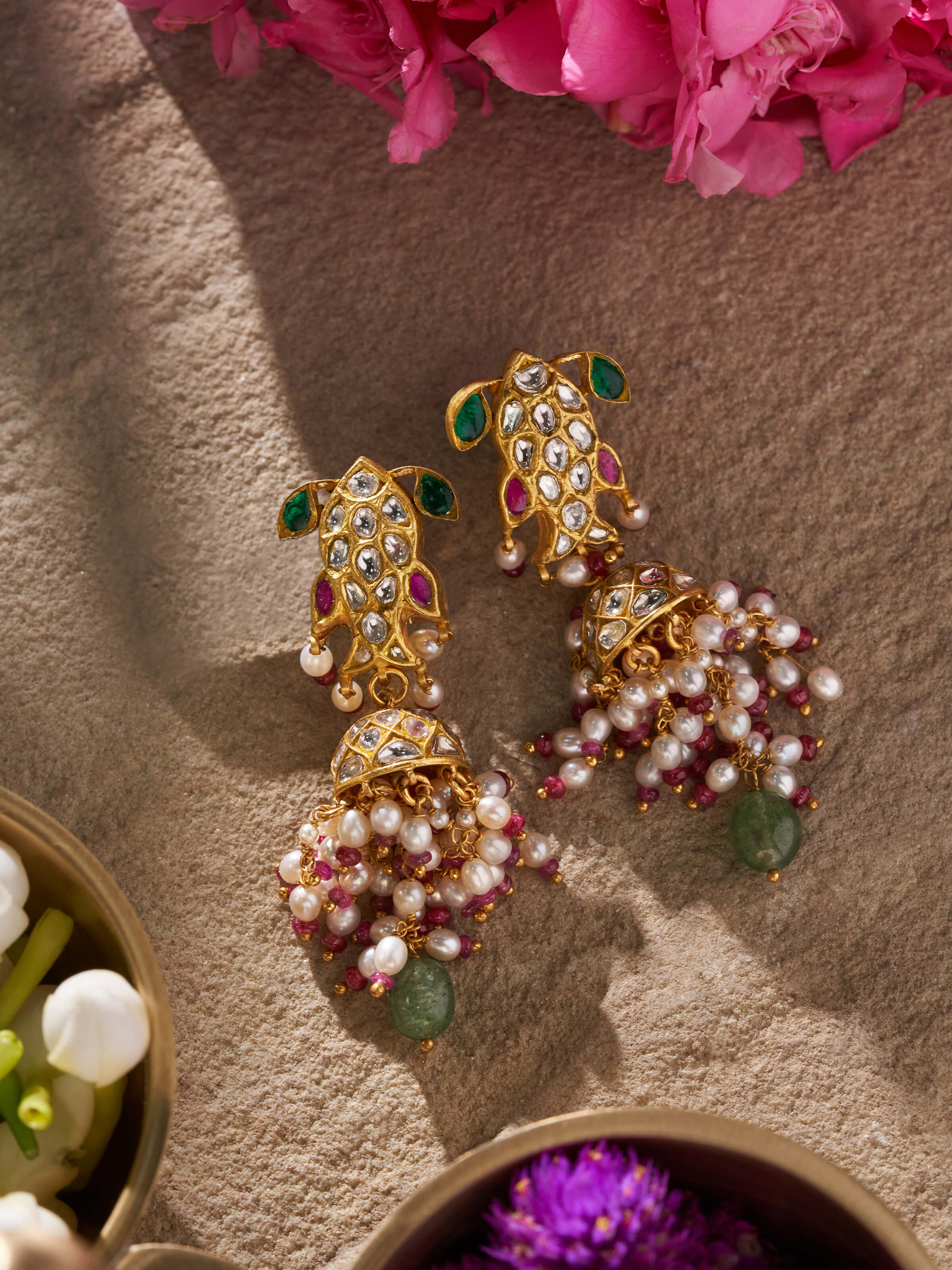 Side view of Thappa 22 karat gold drop earrings emphasizing their elegant design.