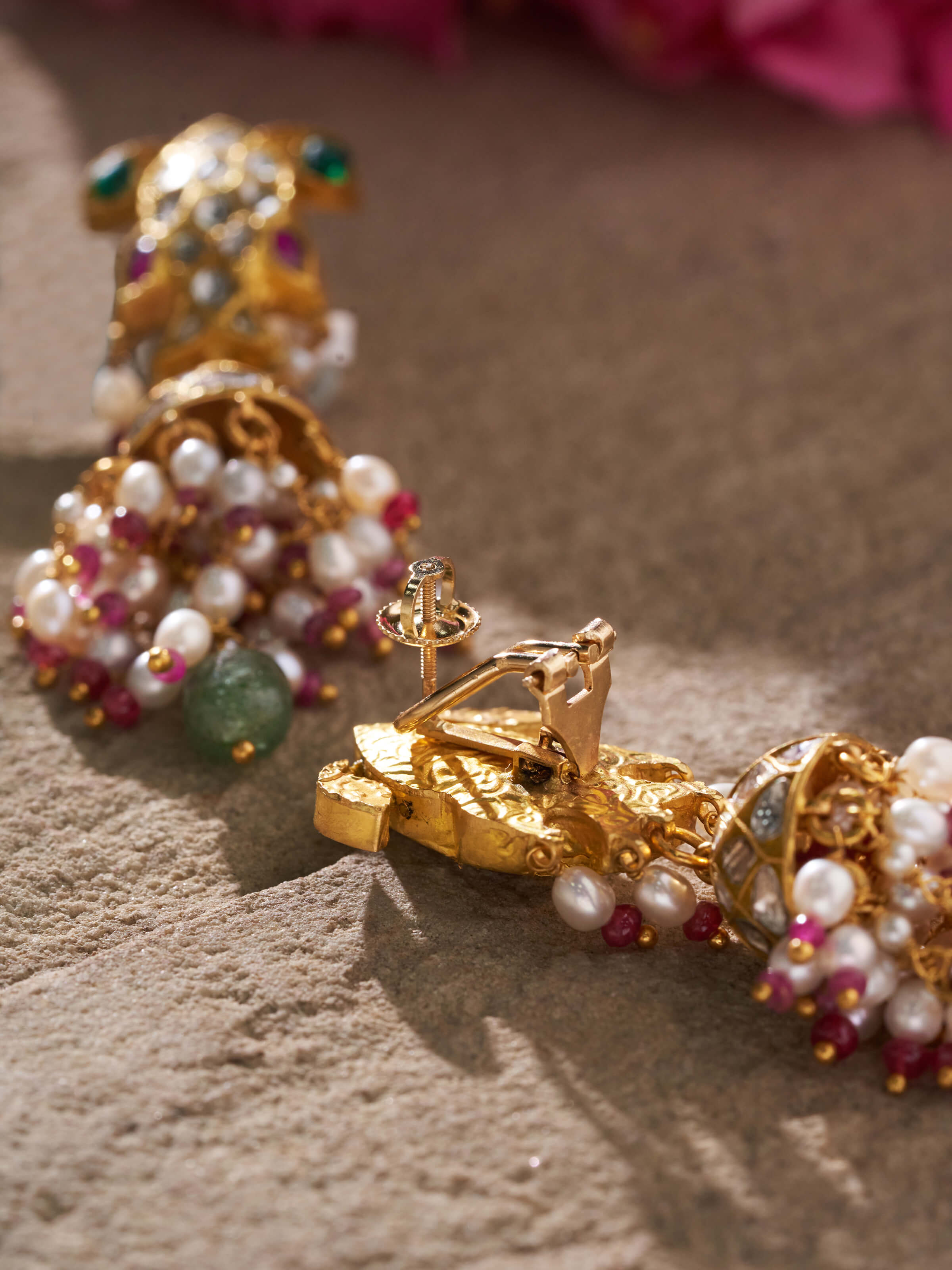 Back view of Thappa 22 karat gold drop earrings highlighting the clasp and design.