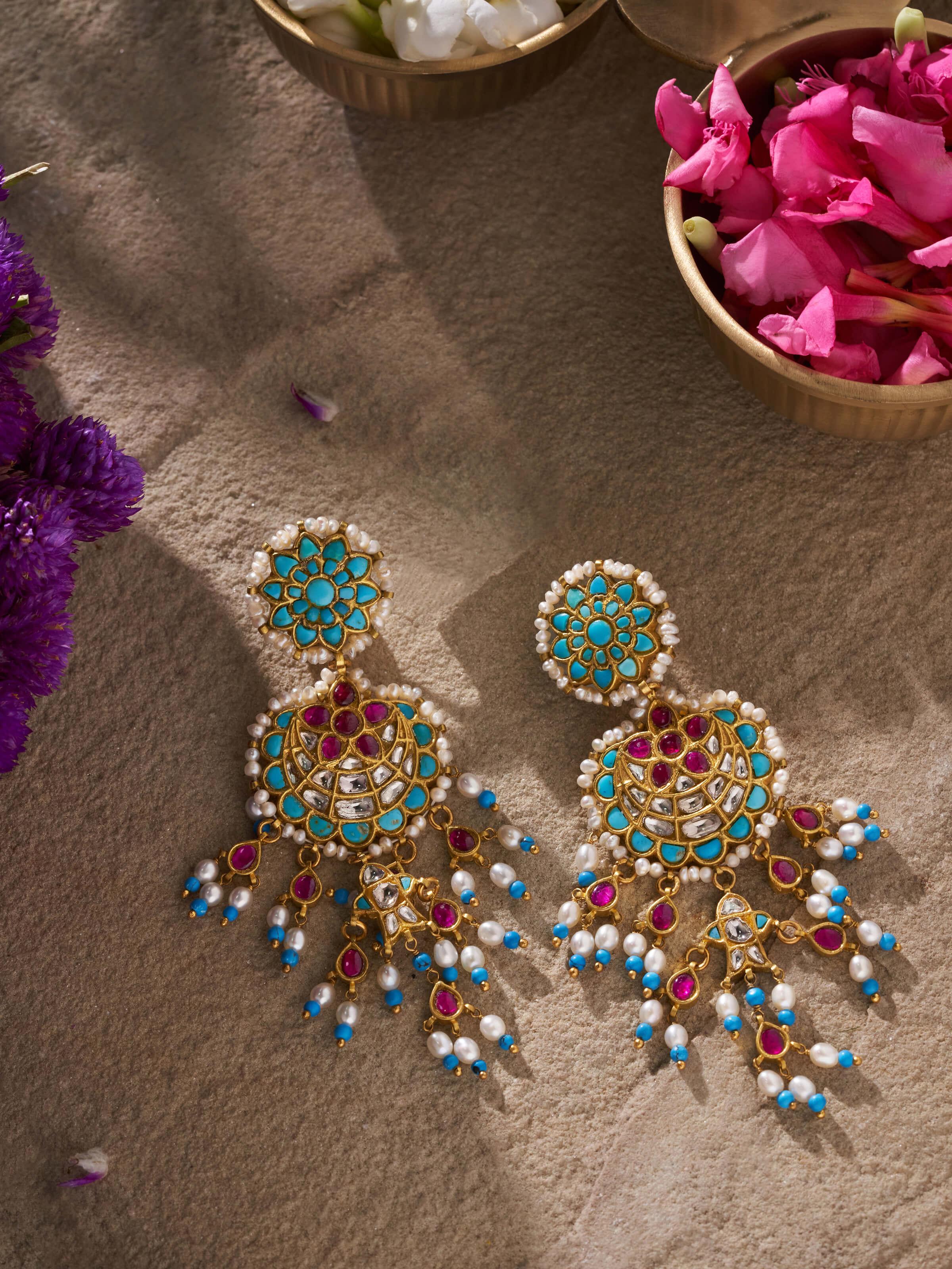 Overhead view of Thappa 22 Karat Gold Drop Earrings by Swadesh emphasizing the symmetrical drop design and rich gold shine