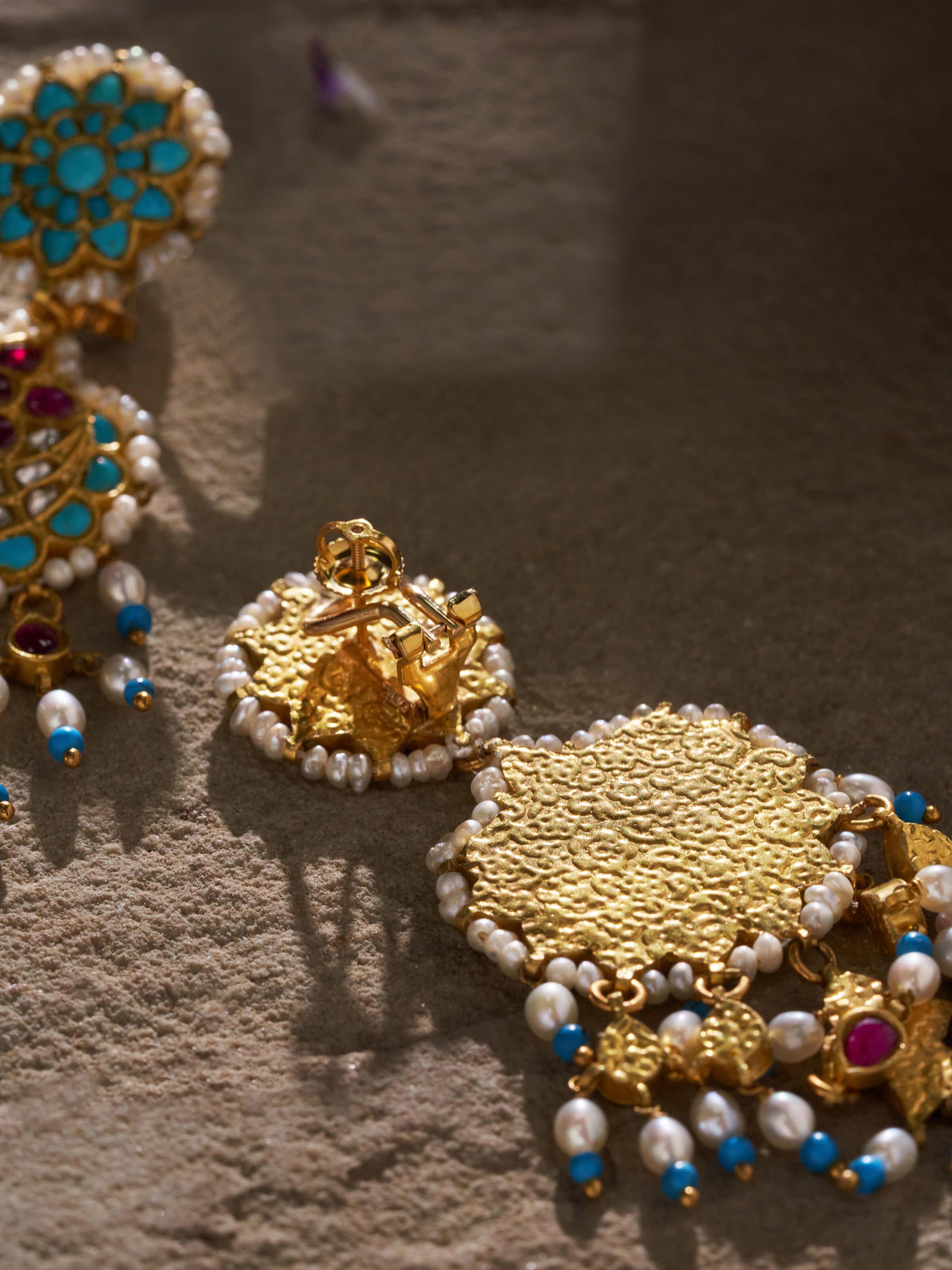 Side view of Silver Smithing Jhumkas by Swadesh emphasizing bell-shaped structure and delicate silver detailing