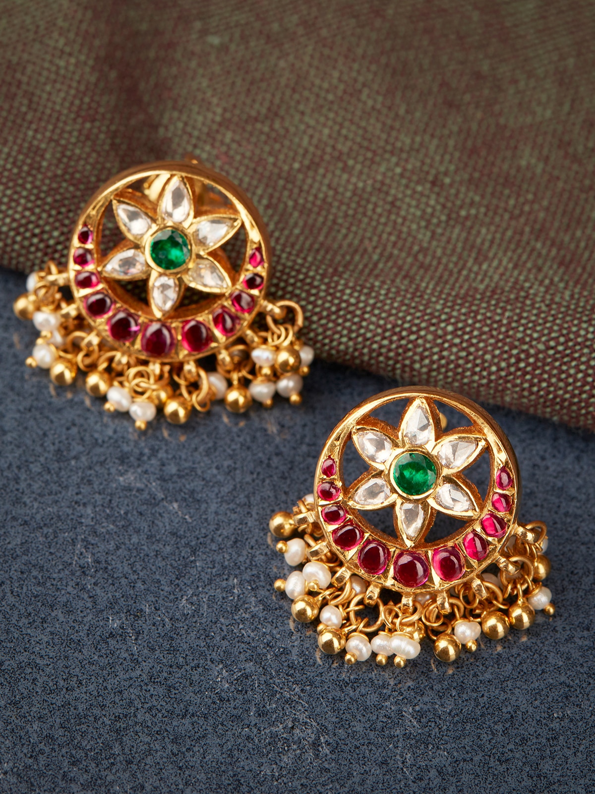 Side view of Kundala Velai 22 Karat Gold drop earrings showcasing their intricate design and high-quality gold.
