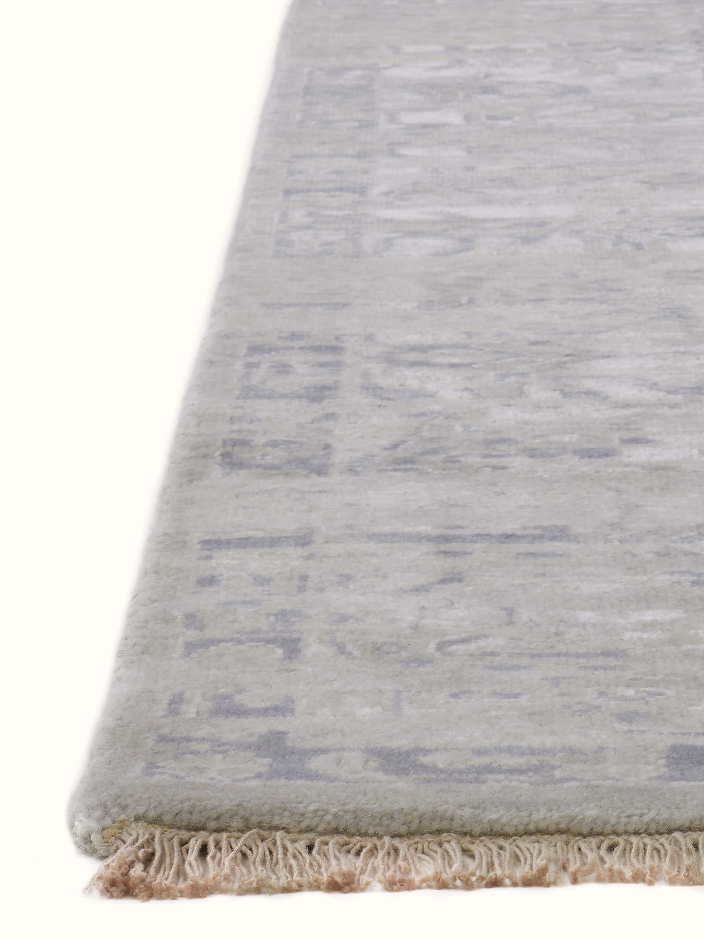 Detailed view of distressed transitional grey blue Bhadohi wool and silk hand-knotted rug, emphasizing pattern