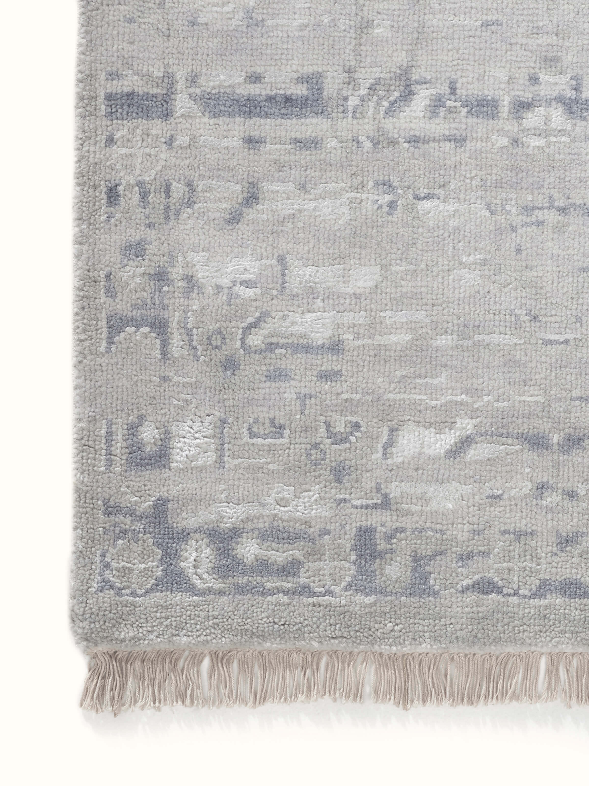 Full image of distressed transitional grey blue Bhadohi wool and silk hand-knotted rug, highlighting its design