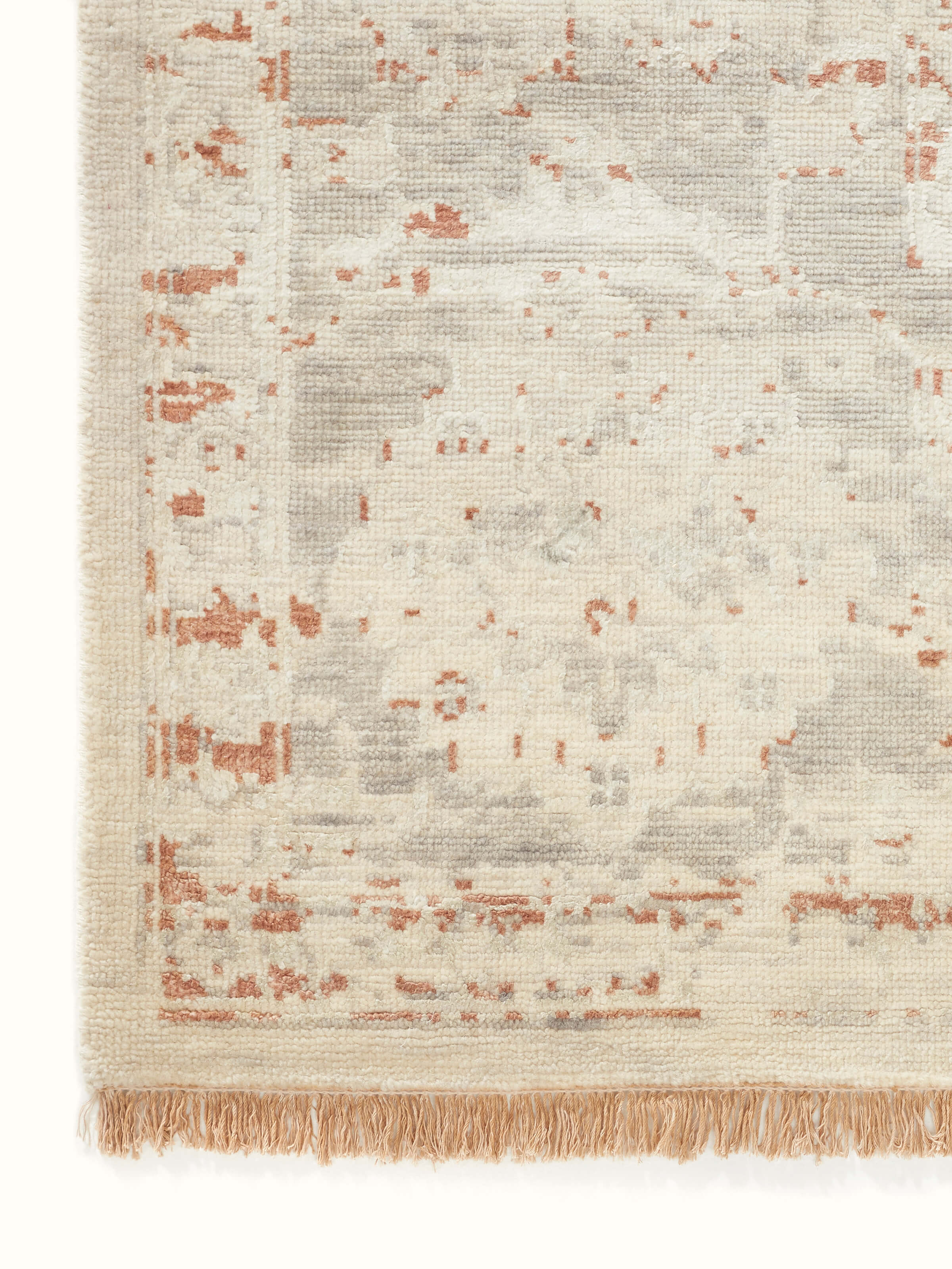 Back view of Distressed transitional beige rust Bhadohi wool & silk hand-knotted rug focusing on the rug’s backing and quality.