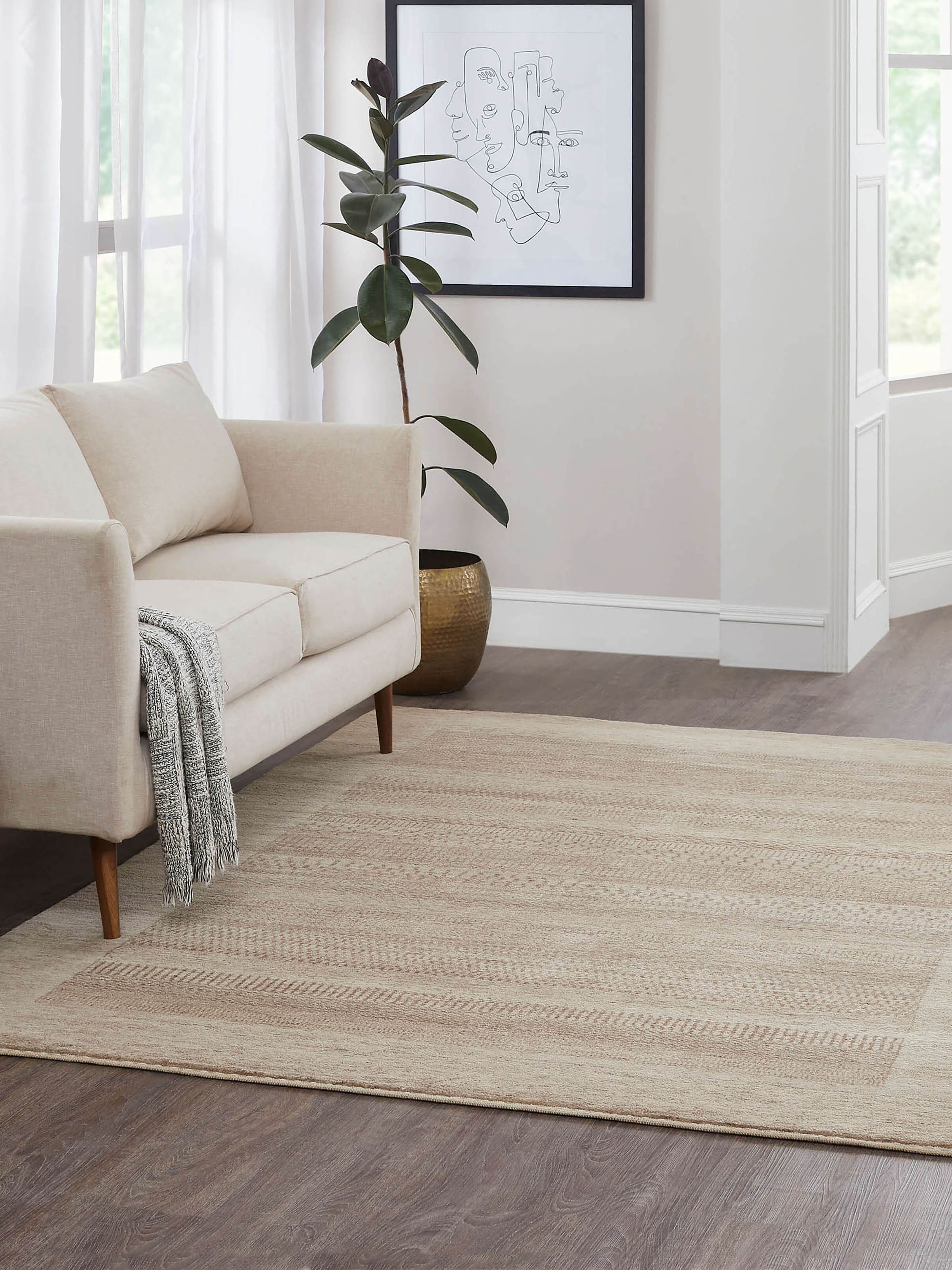 A lifestyle image of the Traditional Gabbeh Beige Cinnamon Wool Hand-knotted Rug crafted in Bhadohi, India, featuring rich cinnamon tones, intricate wool knotting, and traditional carpet weaving artistry.