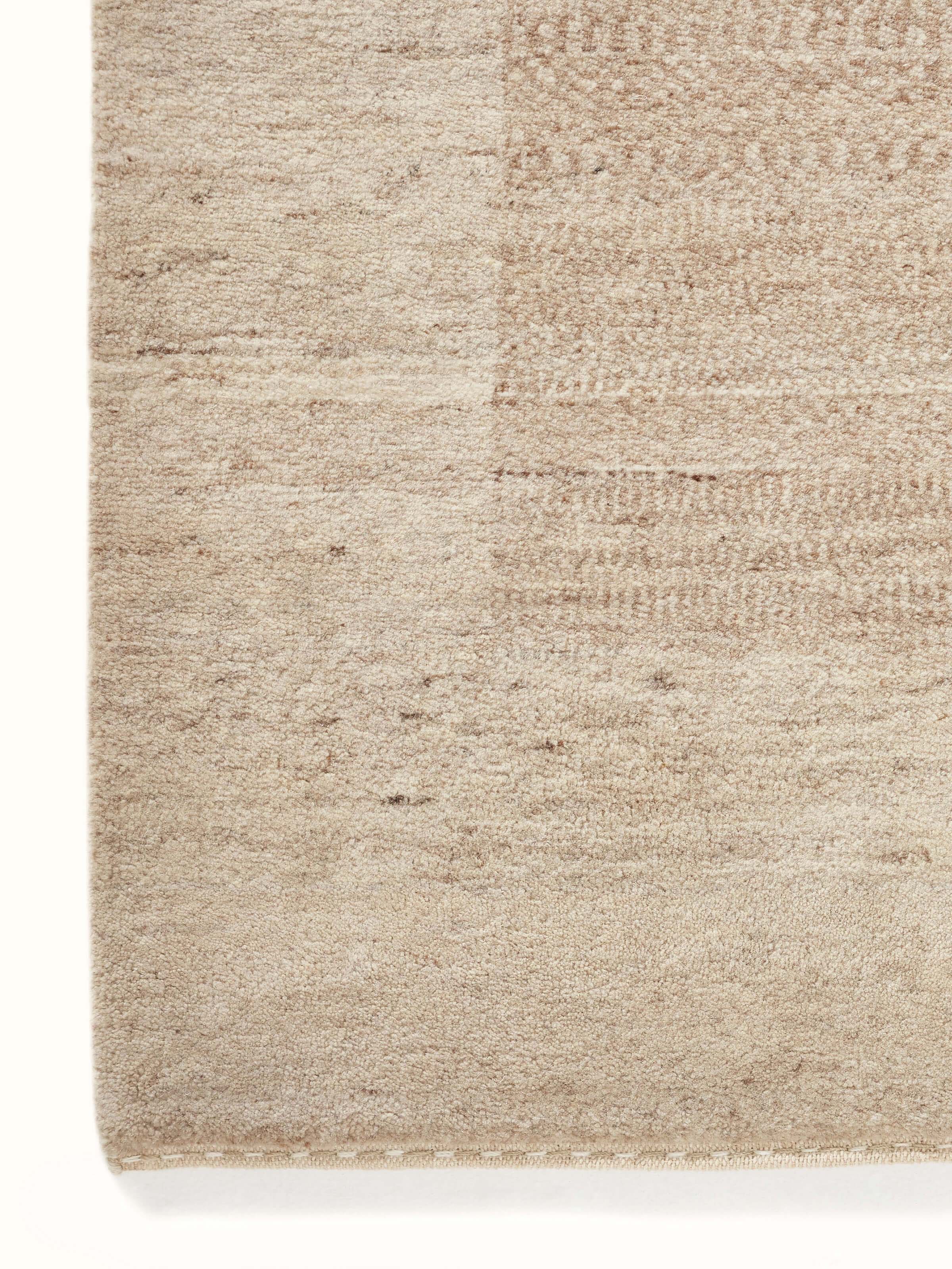 Detailed view of Traditional gabbeh beige brown Bhadohi wool hand-knotted rug highlighting its rich color and texture