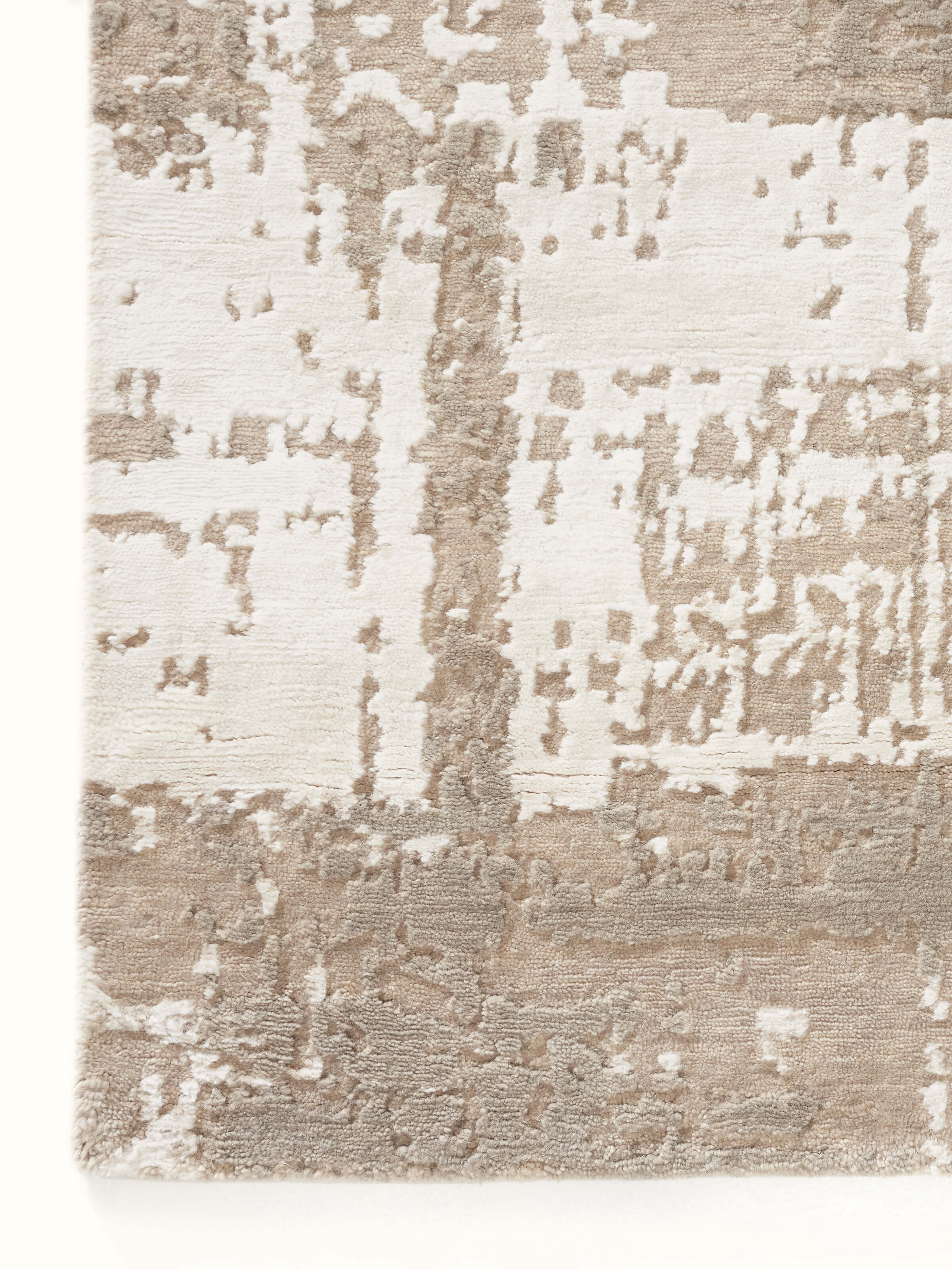 Close-up of Modern distress abstract grey silver Bhadohi wool & viscose hand-knotted rug focusing on intricate detailing