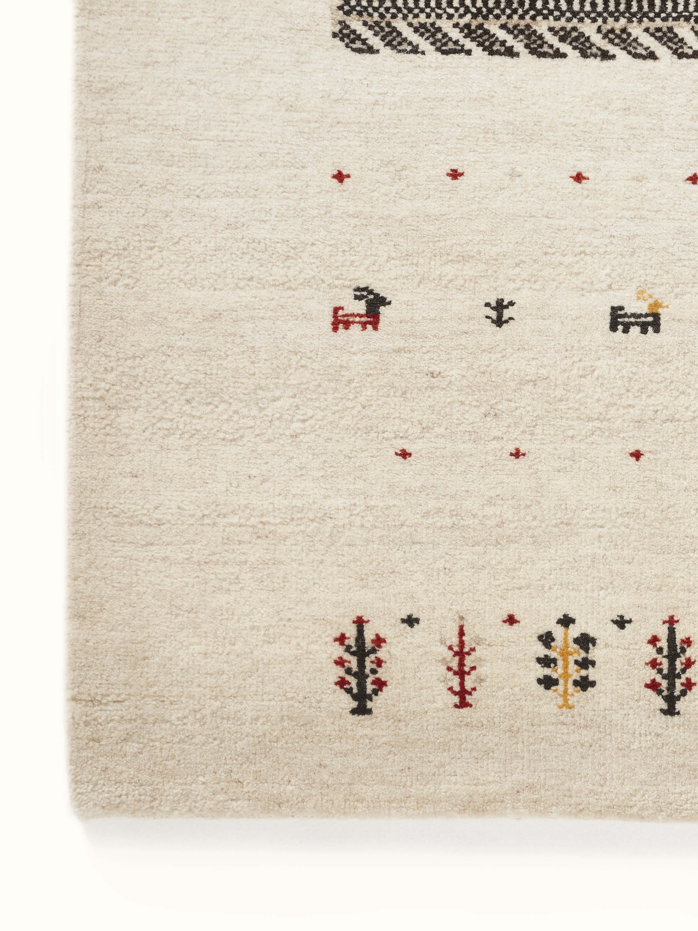 Traditional Gabbeh ivory beige Bhadohi wool hand-knotted rug with kharad pattern, close-up of design.