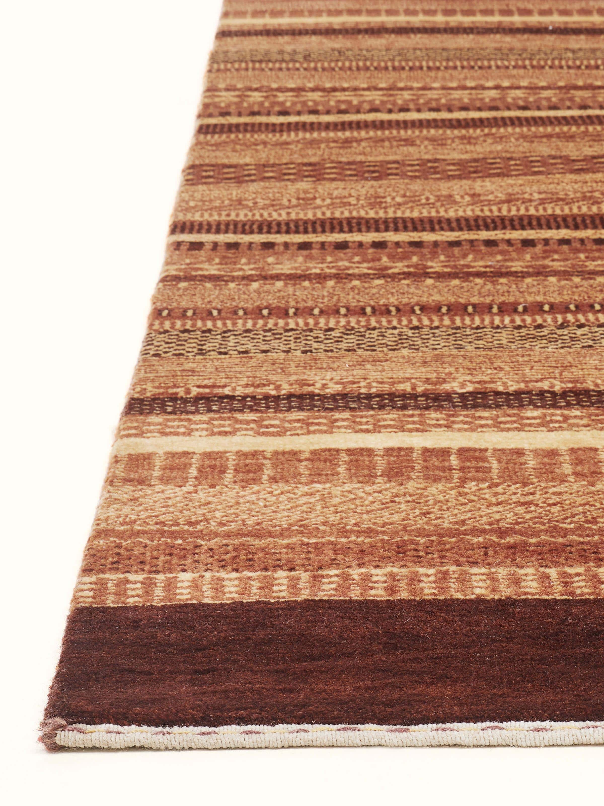 Angle view of Traditional Gabbeh Rust Bhadohi Wool Hand-Knotted Rug displaying the detailed pattern.